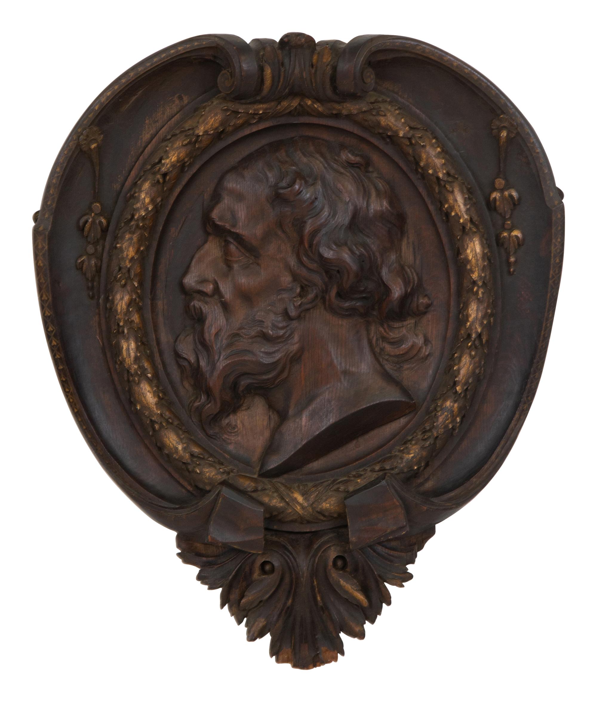 A Pair of Continental Carved Oak and Parcel Gilt Profile Plaques