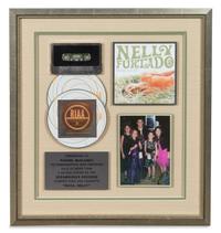 A Nelly Furtado: Woah Nelly RIAA Certified 2x Platinum Presentation Album 17 1/4 x 15 3/4 inches.