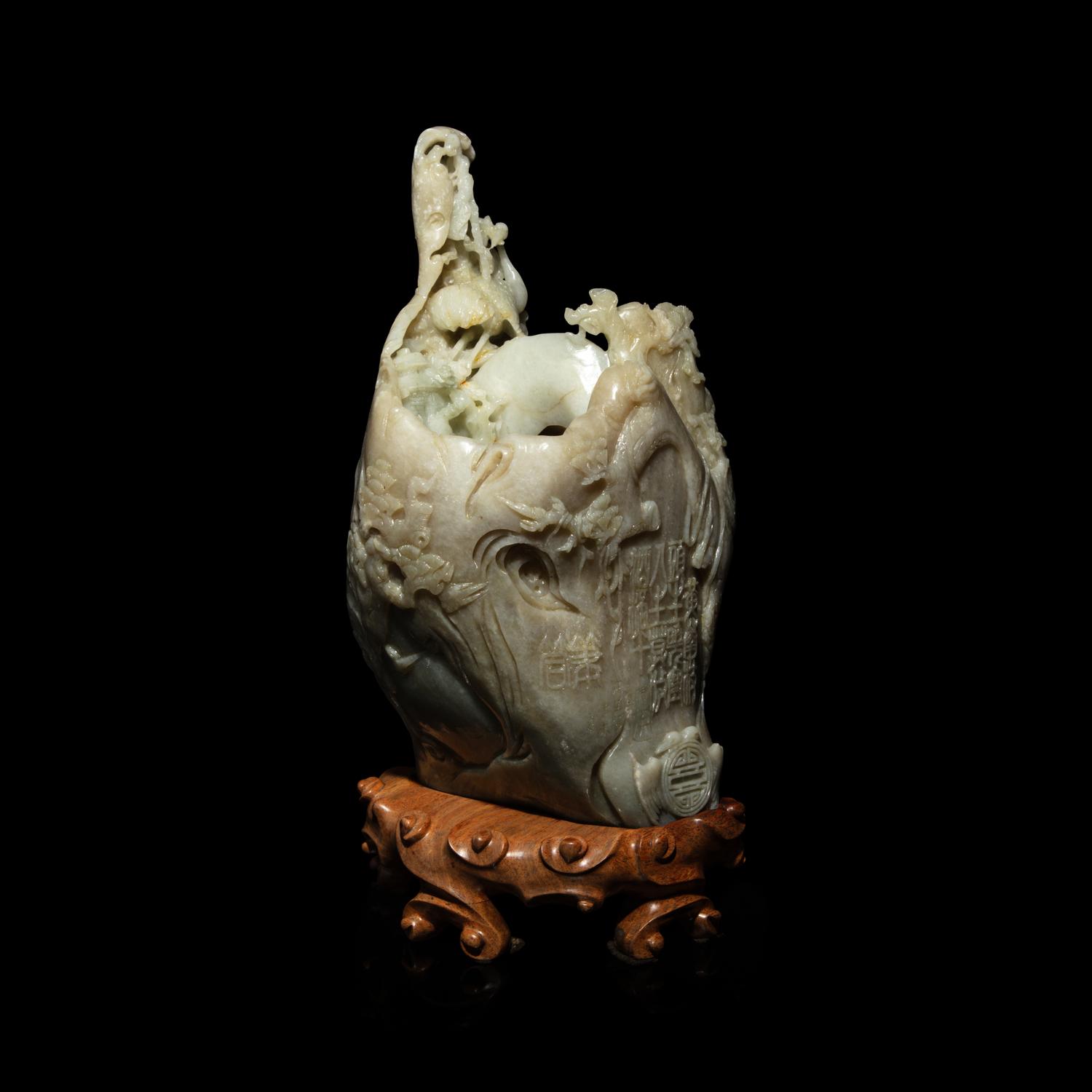 A Chinese Pale Celadon and Russet Jade 'Tree-Trunk' Brushpot, Bitong, 20th Century — 近代 青白玉仿木大筆筒
