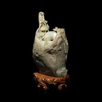 A Chinese Pale Celadon and Russet Jade 'Tree-Trunk' Brushpot, Bitong, 20th Century — 近代 青白玉仿木大筆筒