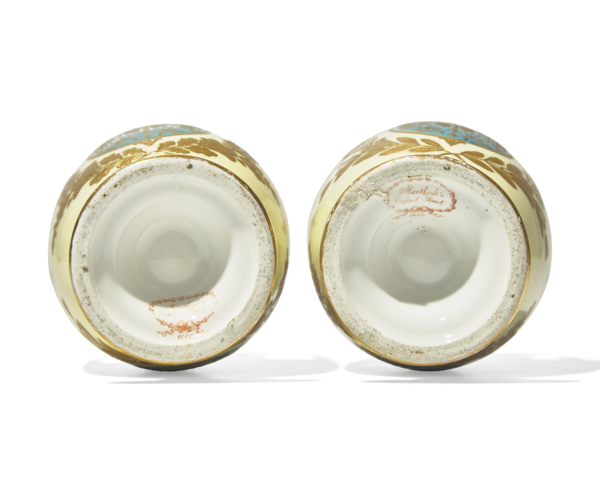 A Pair of English Gilt Decorated Porcelain Urns