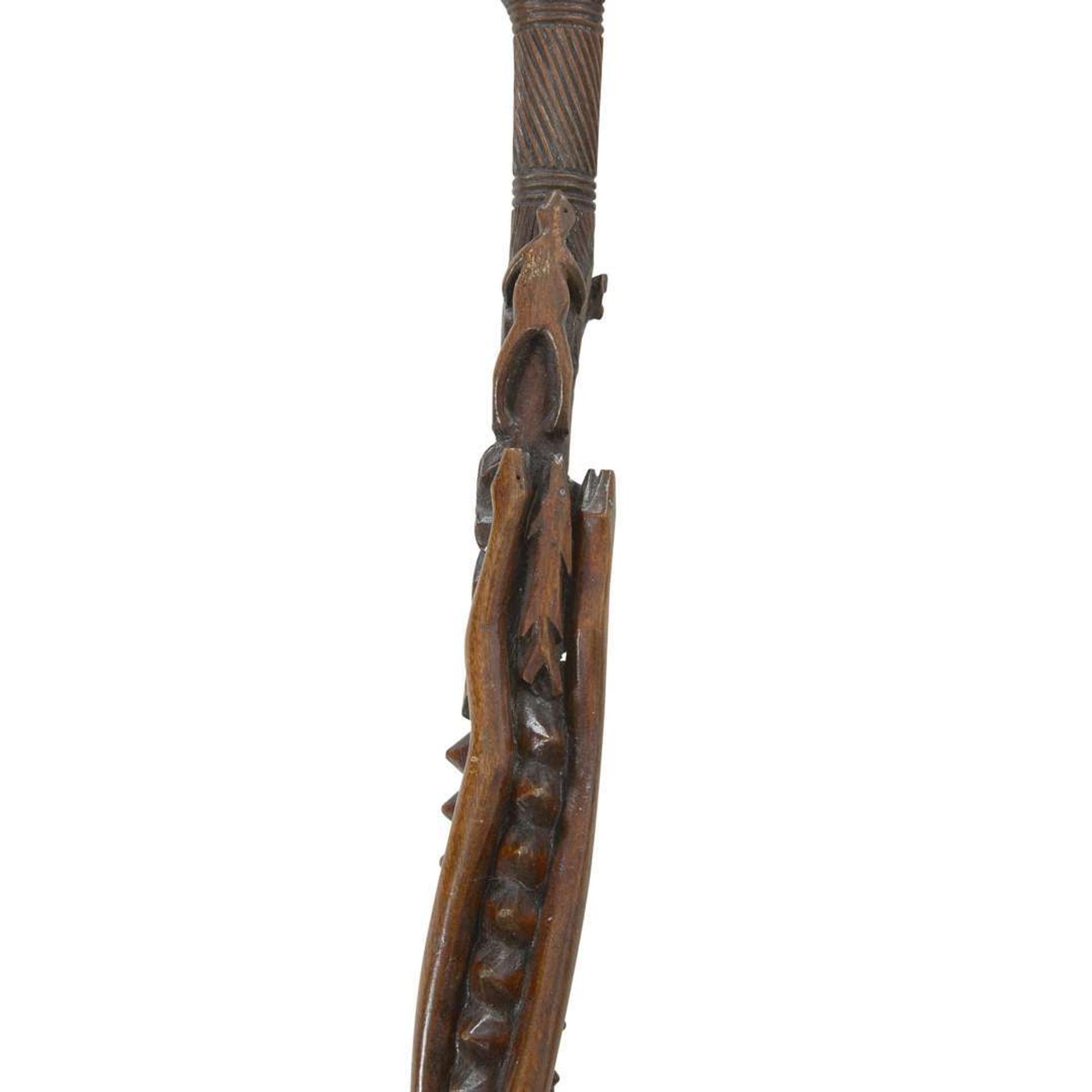 Group of seven carved and painted canes late 19th/early 20th century