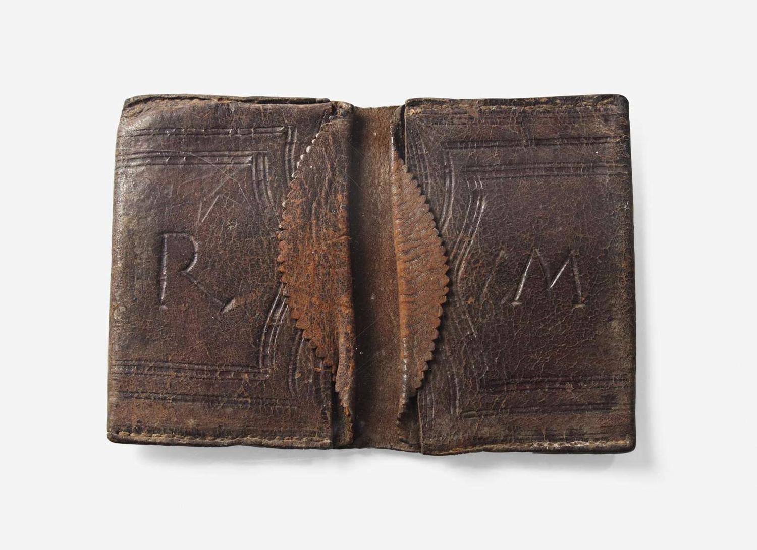 A tooled, dated and initialed leather pocketbook, belonging to Robert Morris, Sr. (1711-1750) and Robert Morris, Jr. (1734-1806), dated "1737"