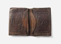 A tooled, dated and initialed leather pocketbook, belonging to Robert Morris, Sr. (1711-1750) and Robert Morris, Jr. (1734-1806), dated "1737"