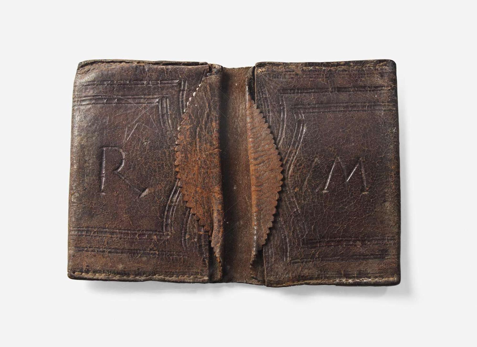 A tooled, dated and initialed leather pocketbook, belonging to Robert Morris, Sr. (1711-1750) and Robert Morris, Jr. (1734-1806), dated "1737"