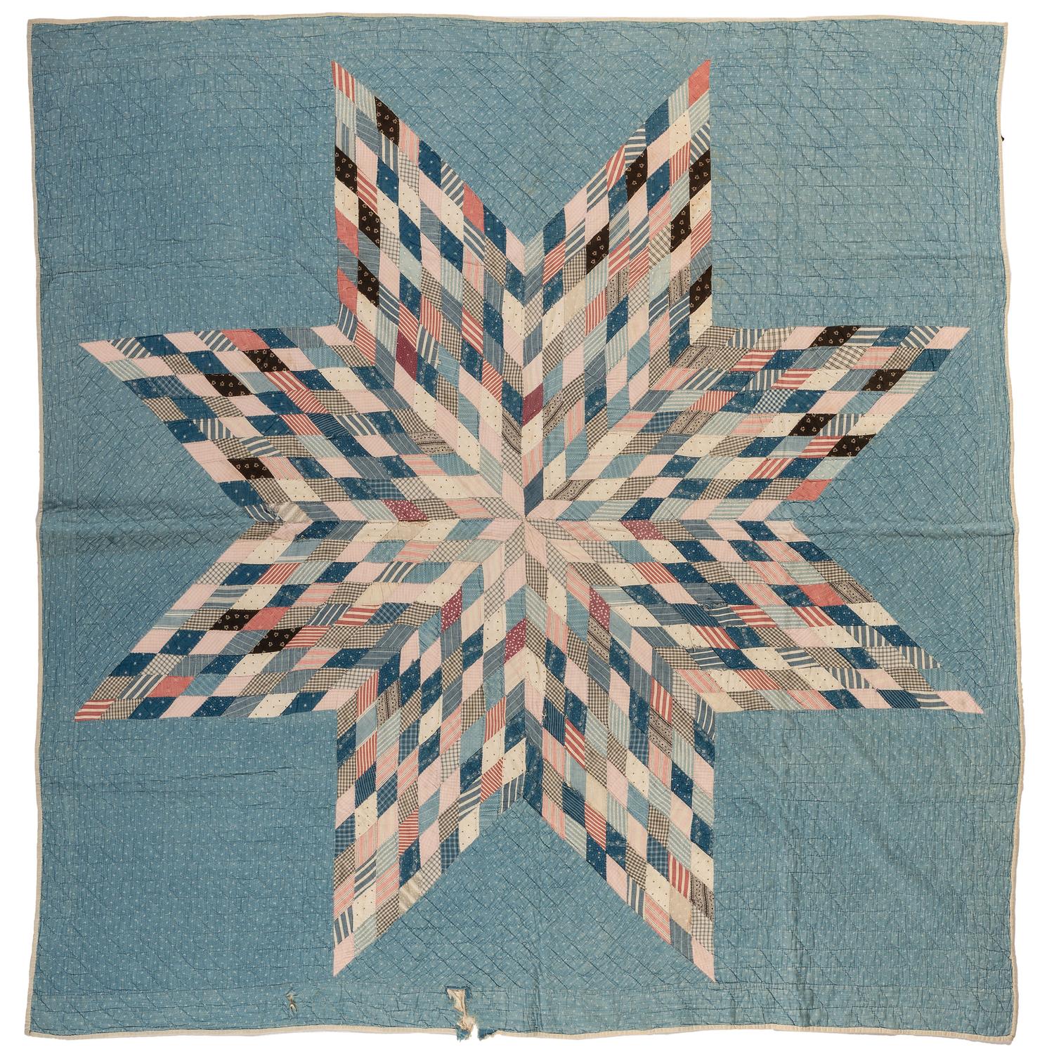 A Star Patterned Pieced Quilt
