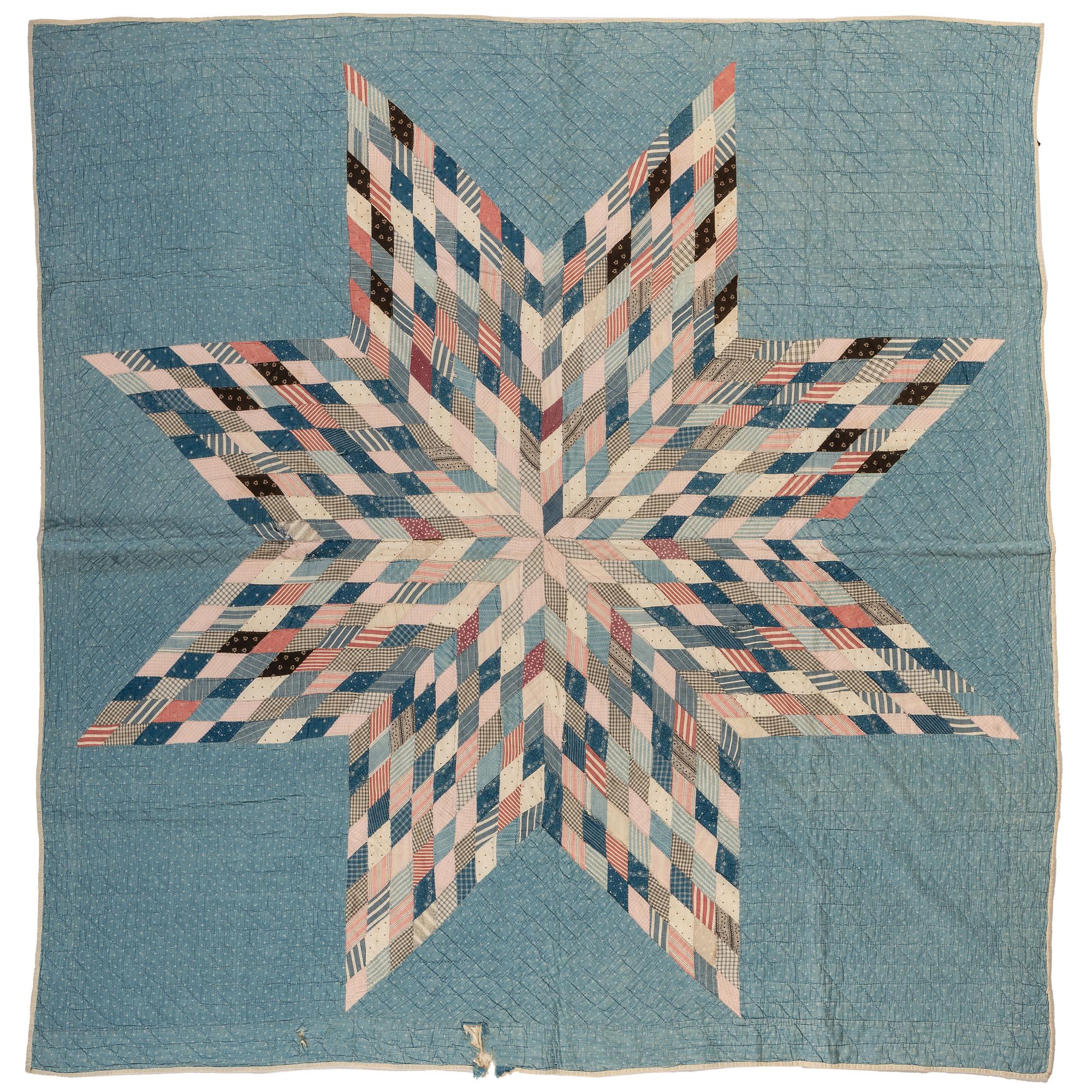 A Star Patterned Pieced Quilt