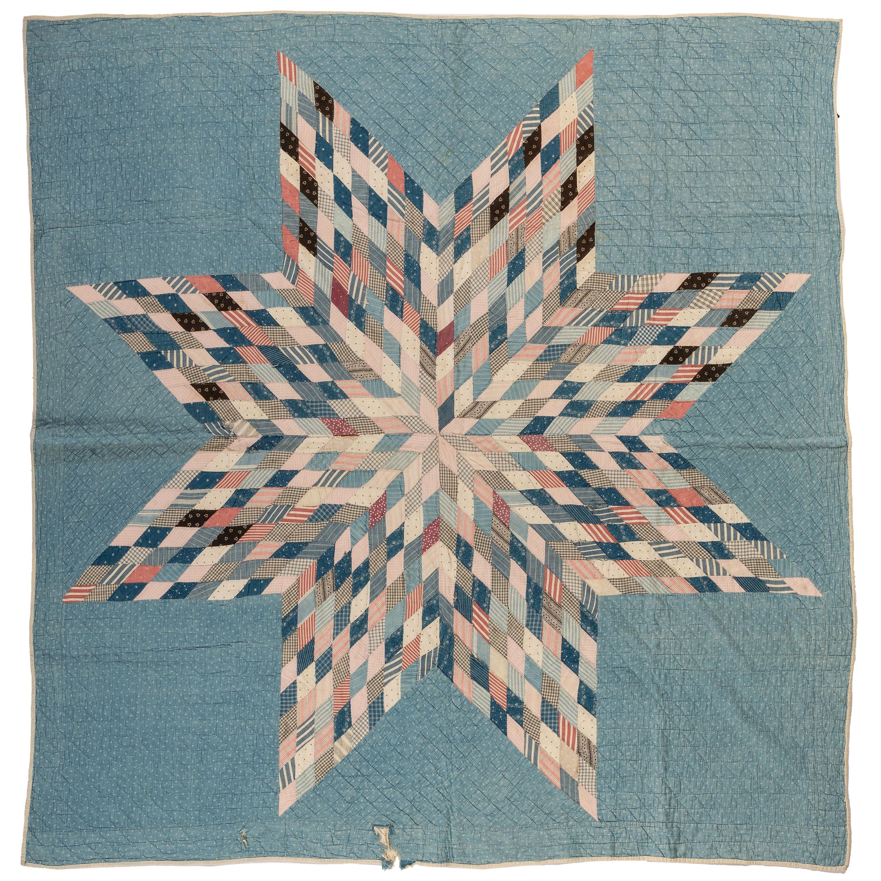 A Star Patterned Pieced Quilt