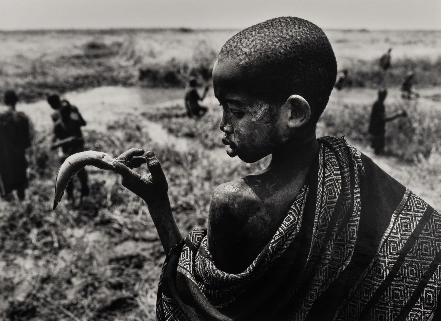Sebastião Salgado (born 1944) Fishing in the marshes of the Gel Canal, which is filled with waters from the Nile River, Southern Sudan, from the series "Genesis," 2006