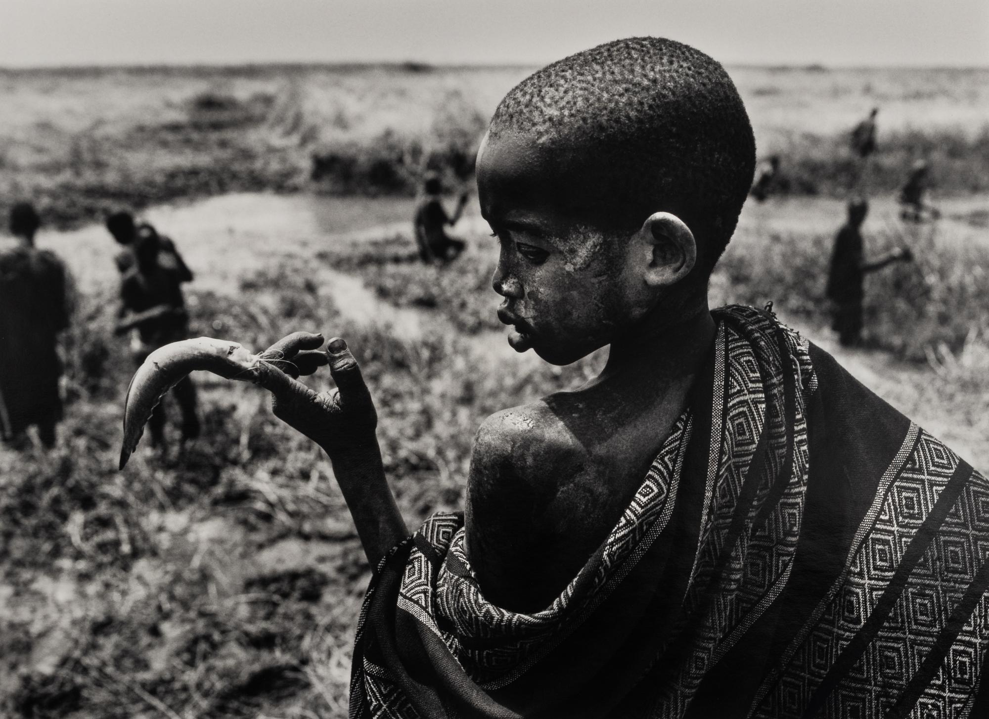 Sebastião Salgado (born 1944) Fishing in the marshes of the Gel Canal, which is filled with waters from the Nile River, Southern Sudan, from the series "Genesis," 2006
