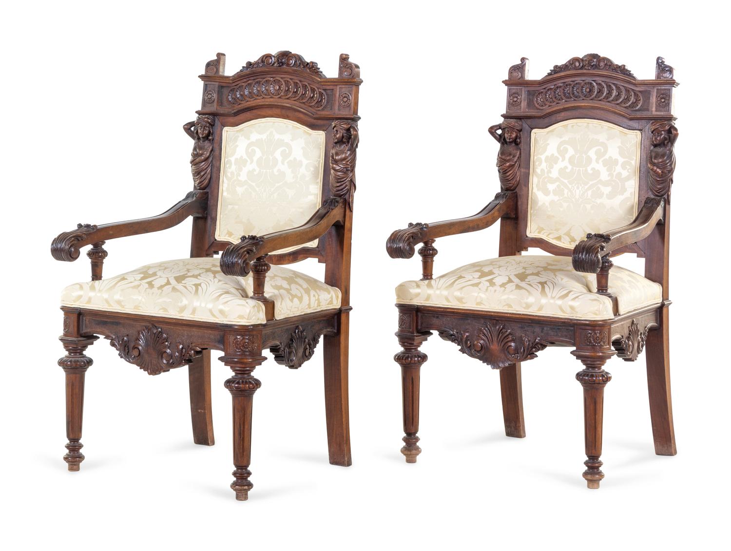 A Pair of French Renaissance Revival Carved Walnut Armchairs