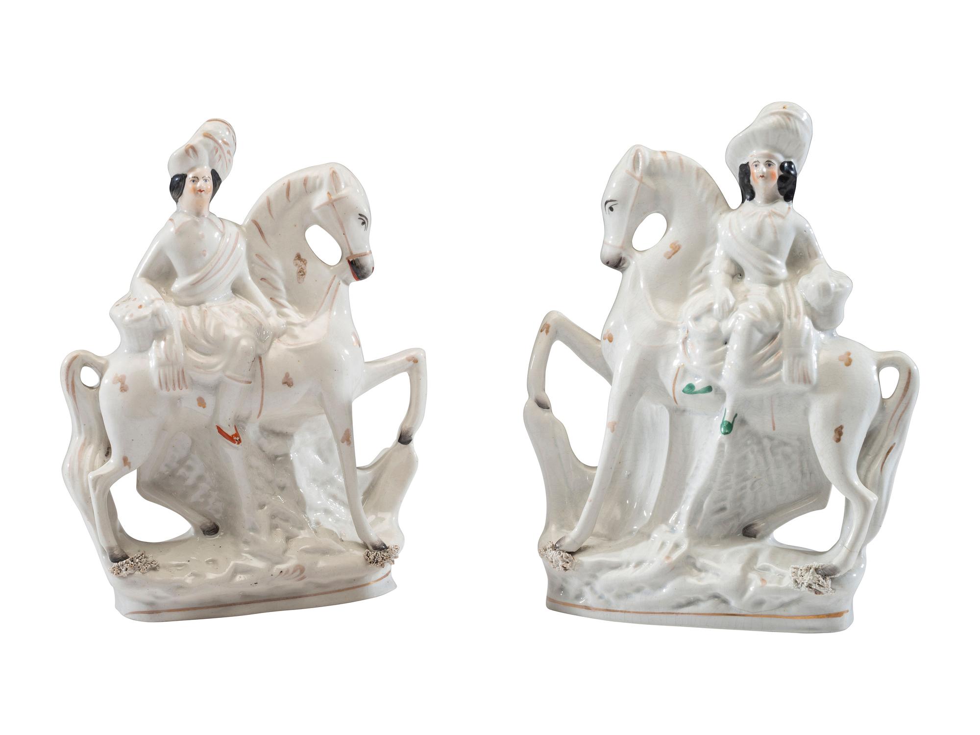 A Pair of Staffordshire Equestrian Figures