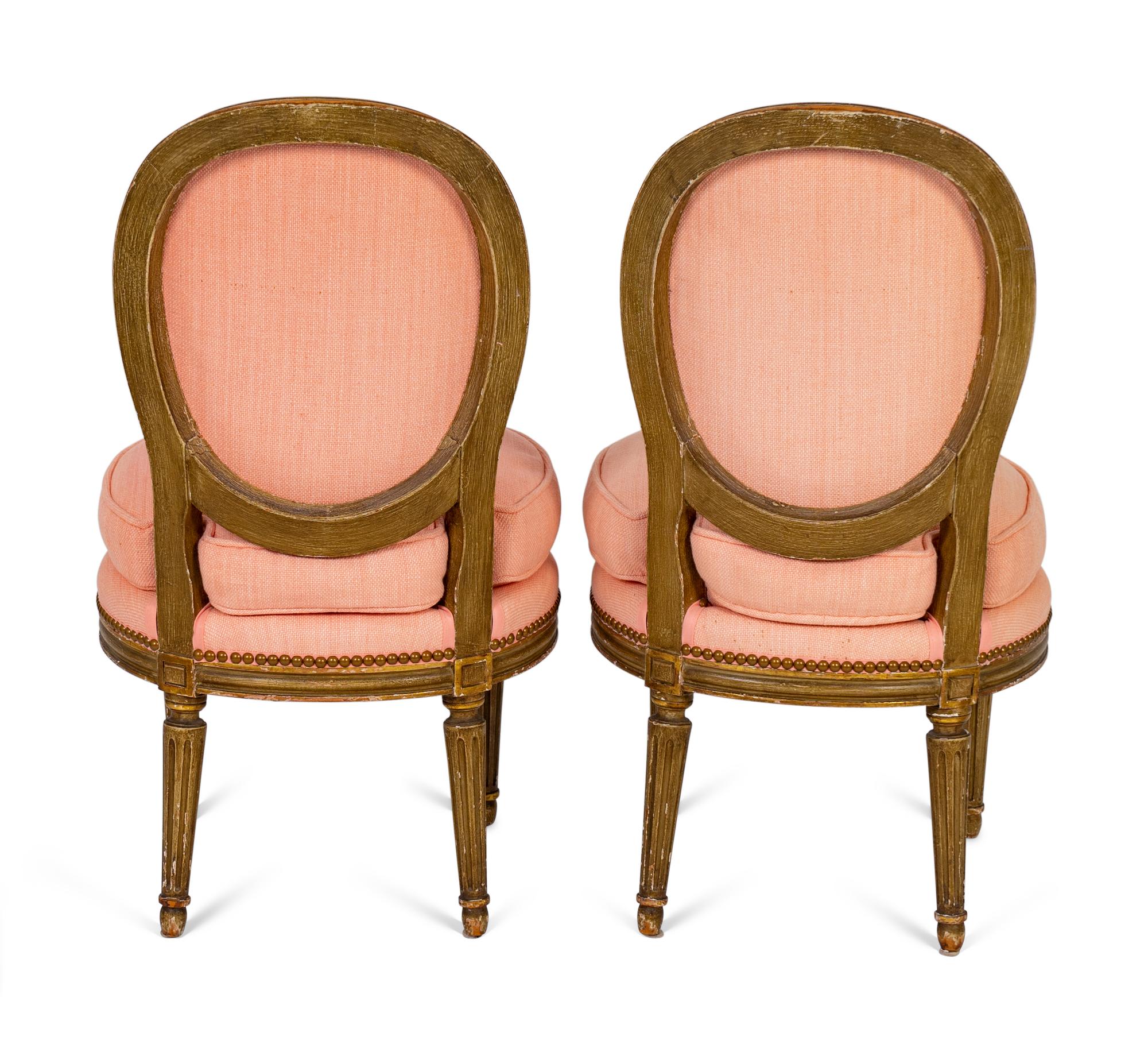 A Pair of Louis XVI Parcel-Gilt Petite Boudoir Chairs — 19TH CENTURY