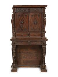 An Italian Carved Walnut Cabinet on Stand