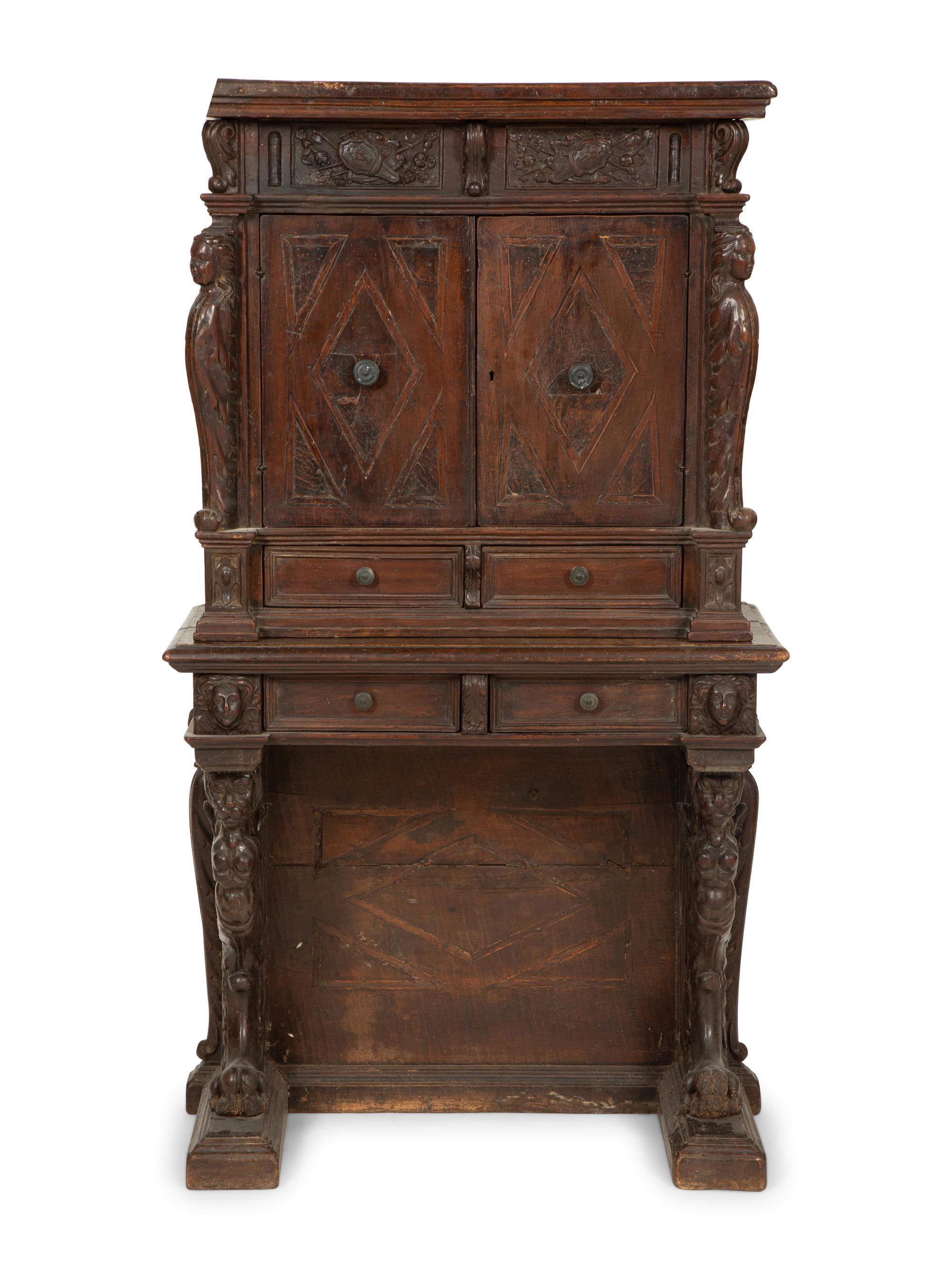 An Italian Carved Walnut Cabinet on Stand