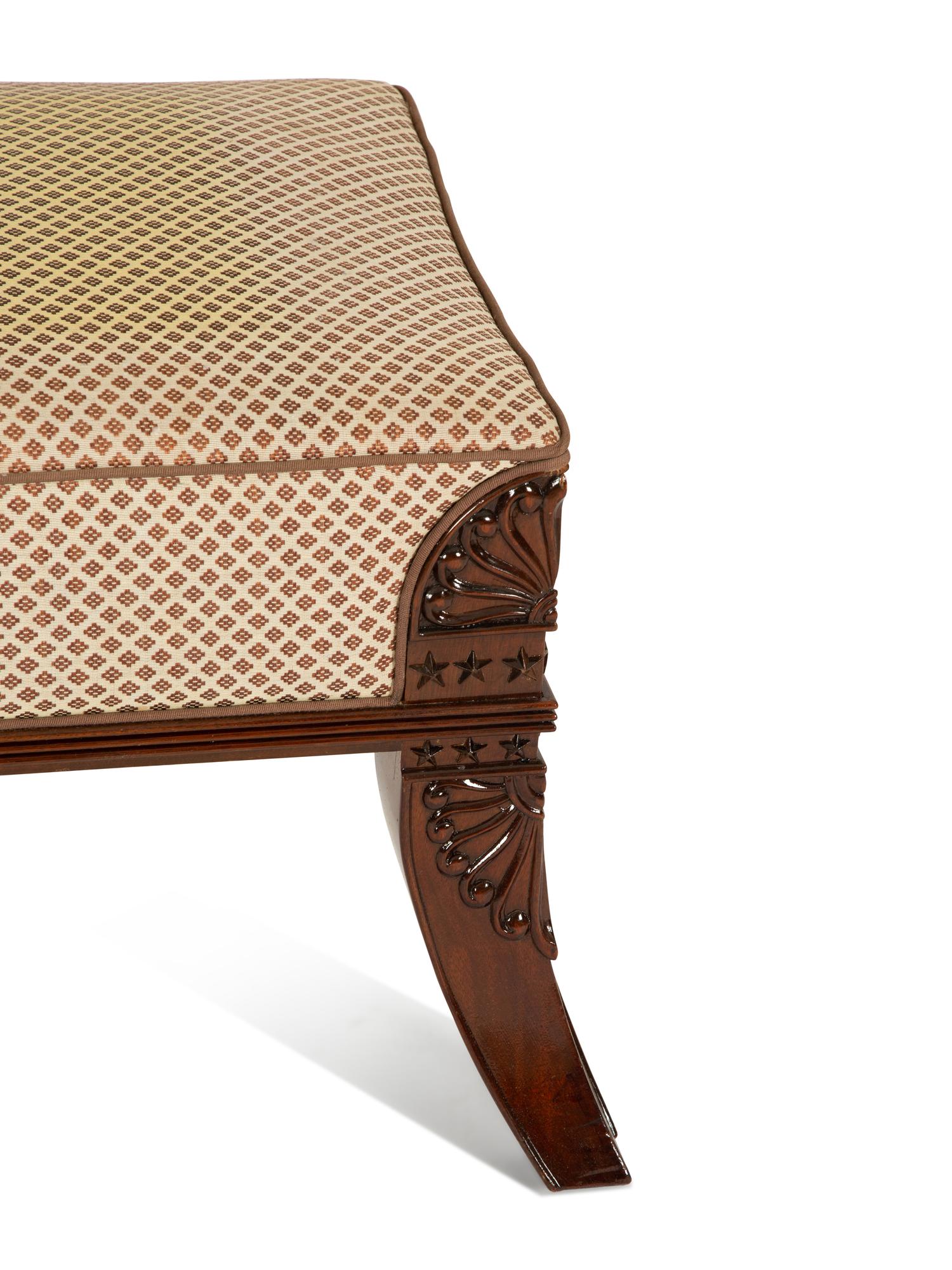 An Egyptian Revival Carved Mahogany Ottoman with Upholstered Seat — 20th Century