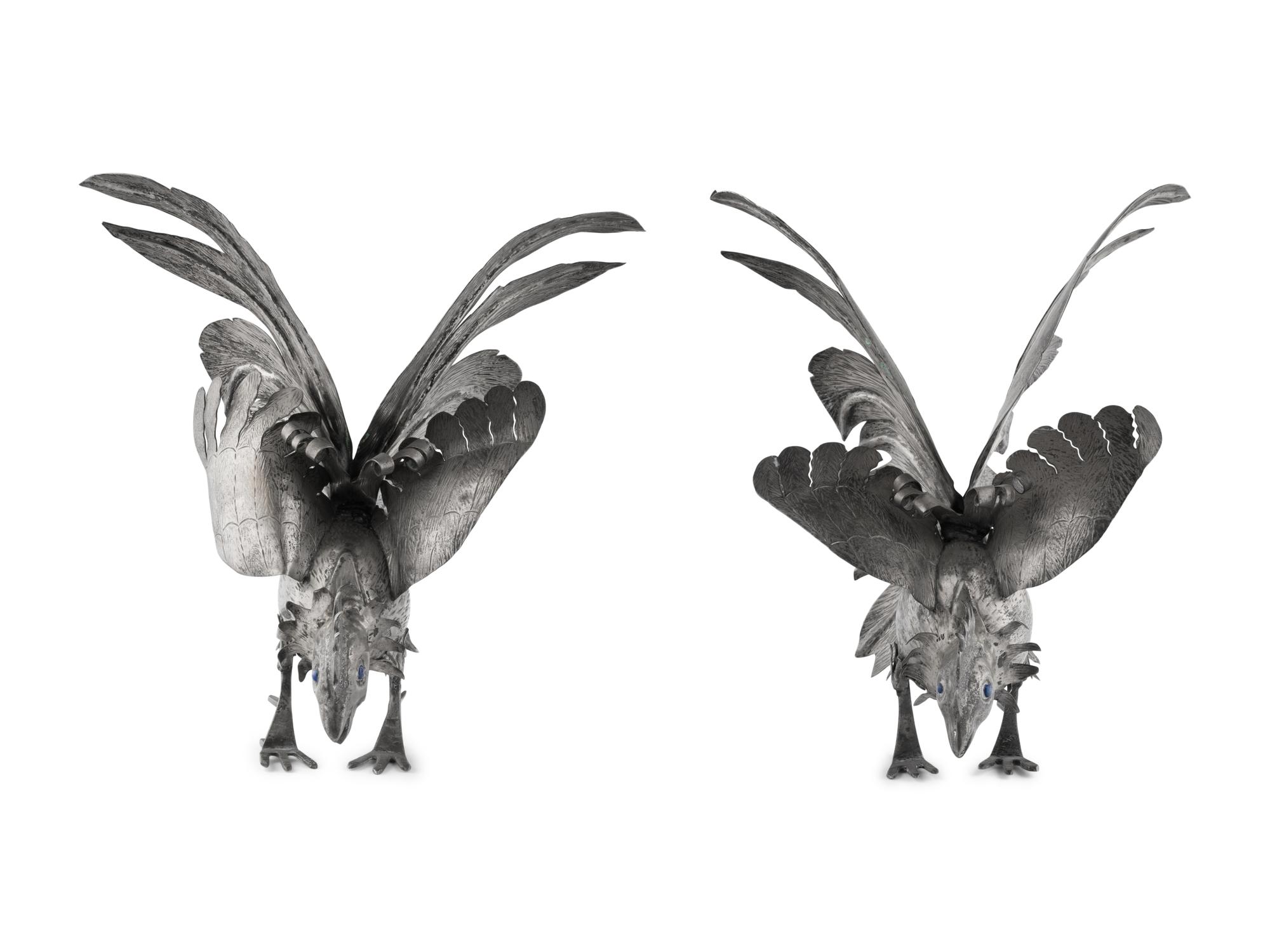 A Pair of Continental Silvered-Metal Roosters