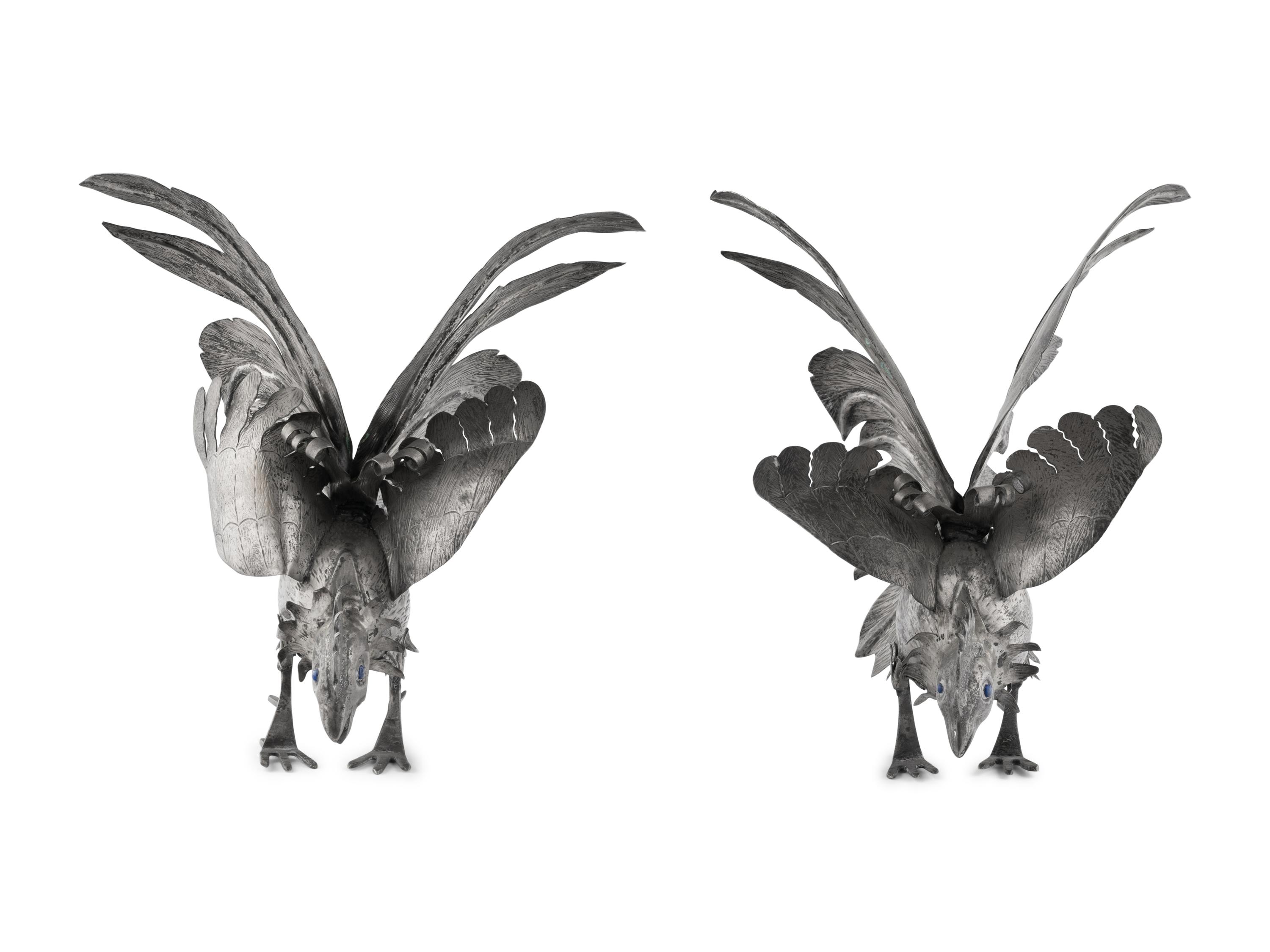 A Pair of Continental Silvered-Metal Roosters