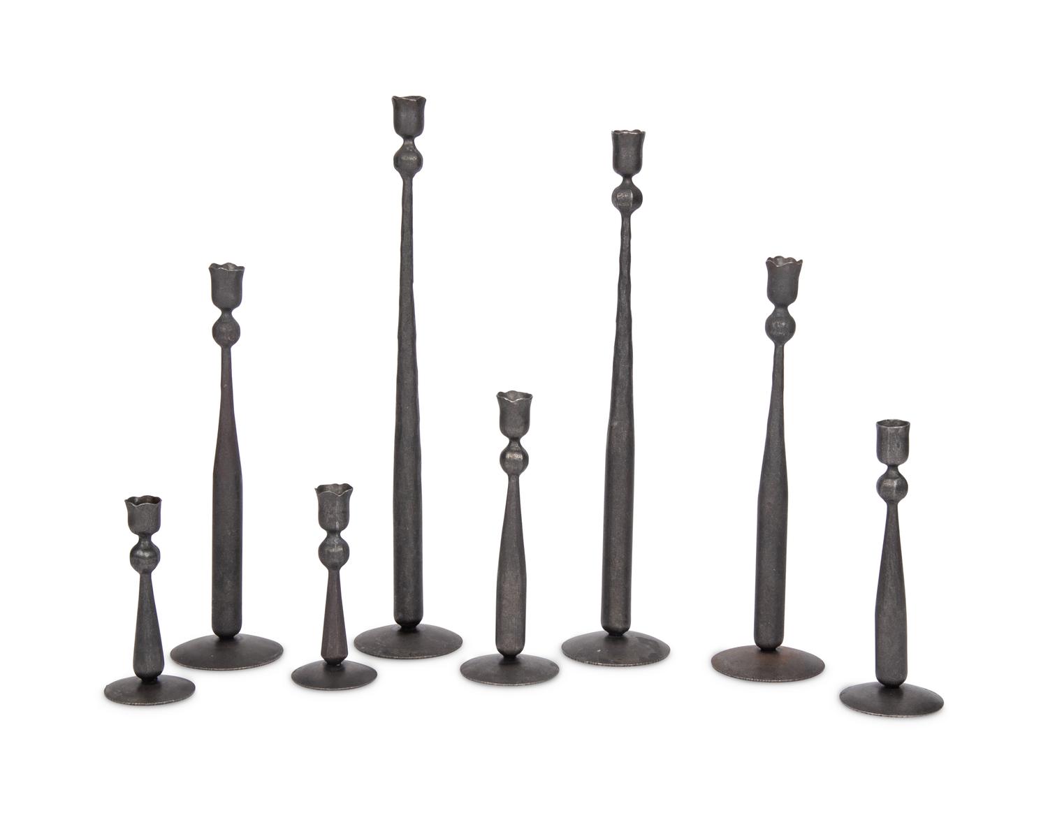 A Set of Eight Wrought Iron Candlesticks