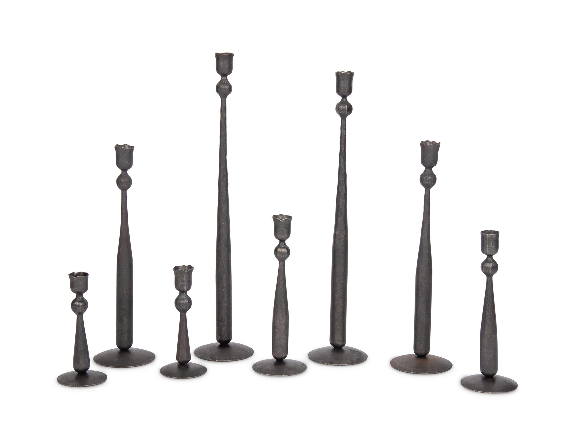 A Set of Eight Wrought Iron Candlesticks