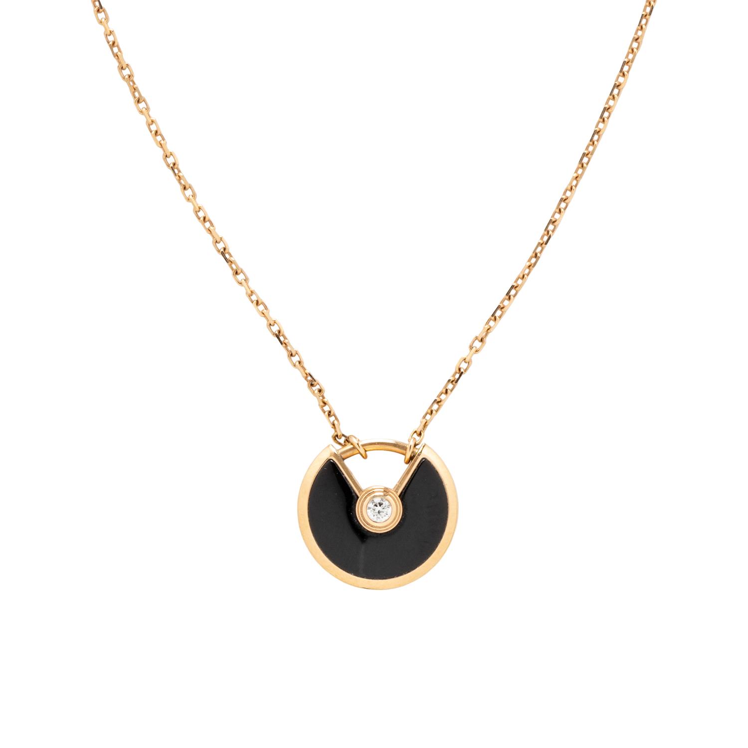 CARTIER, ROSE GOLD, ONYX, AND DIAMOND 'AMULETTE DE CARTIER' NECKLACE