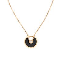 CARTIER, ROSE GOLD, ONYX, AND DIAMOND 'AMULETTE DE CARTIER' NECKLACE