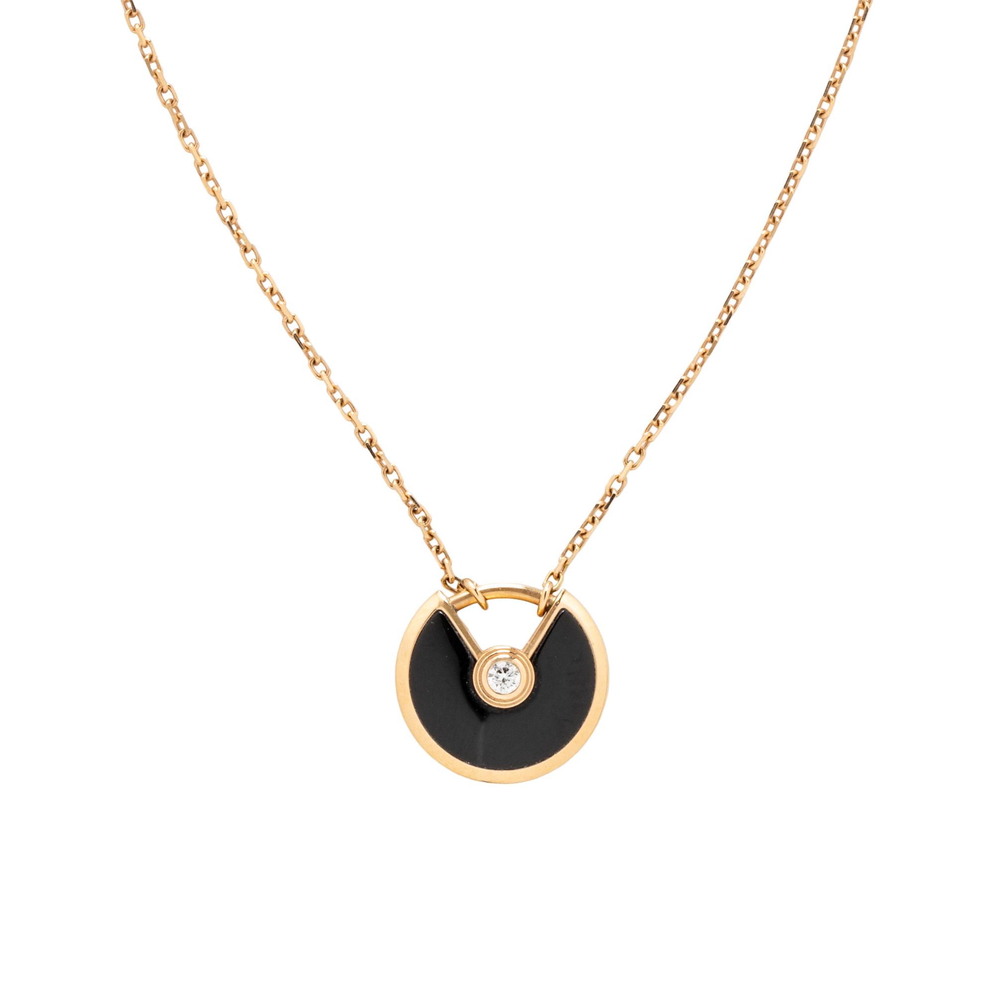 CARTIER, ROSE GOLD, ONYX, AND DIAMOND 'AMULETTE DE CARTIER' NECKLACE