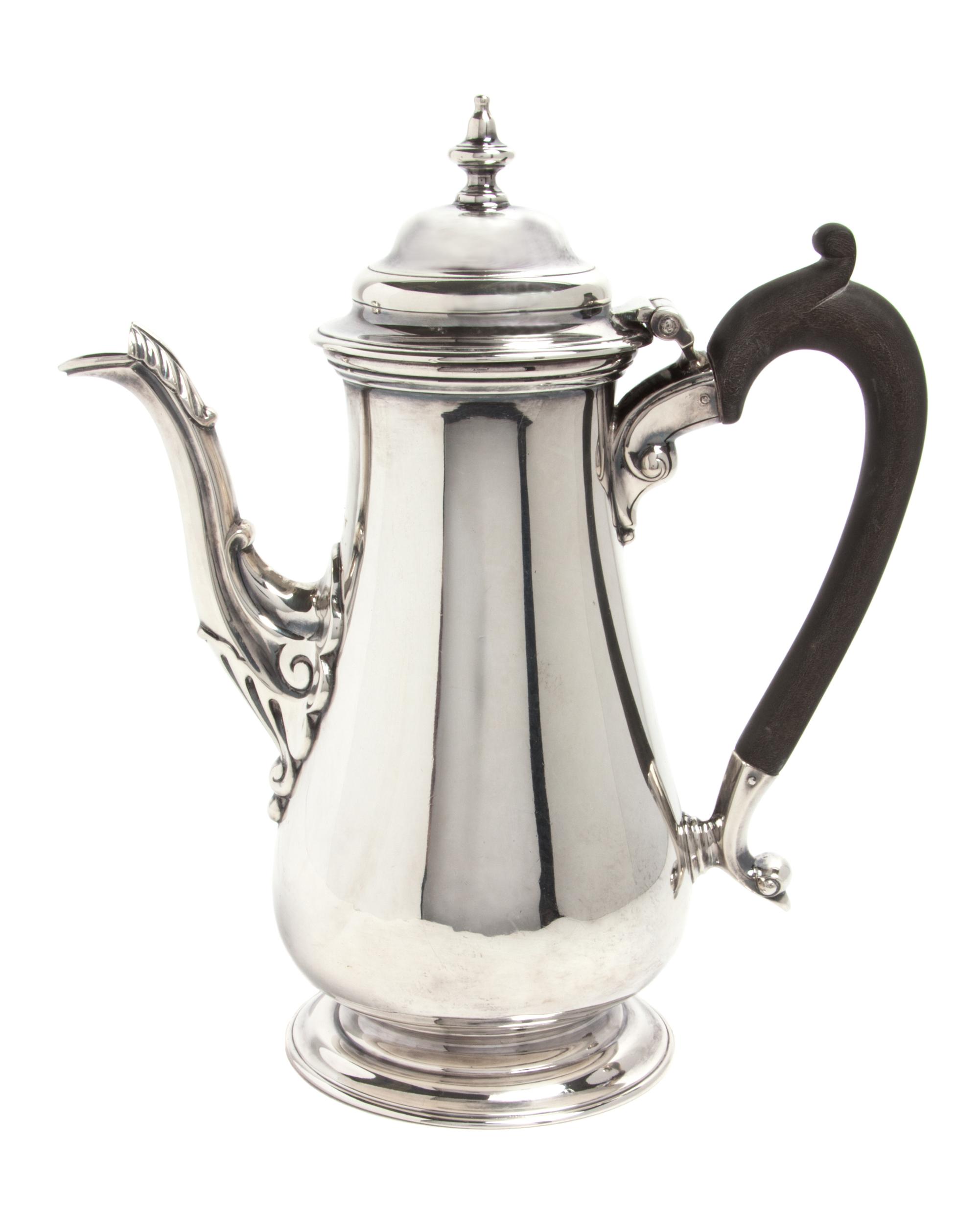 An English Silver Chocolate Pot, George Hape, Sheffield, 1906, of baluster form with a wood handle.