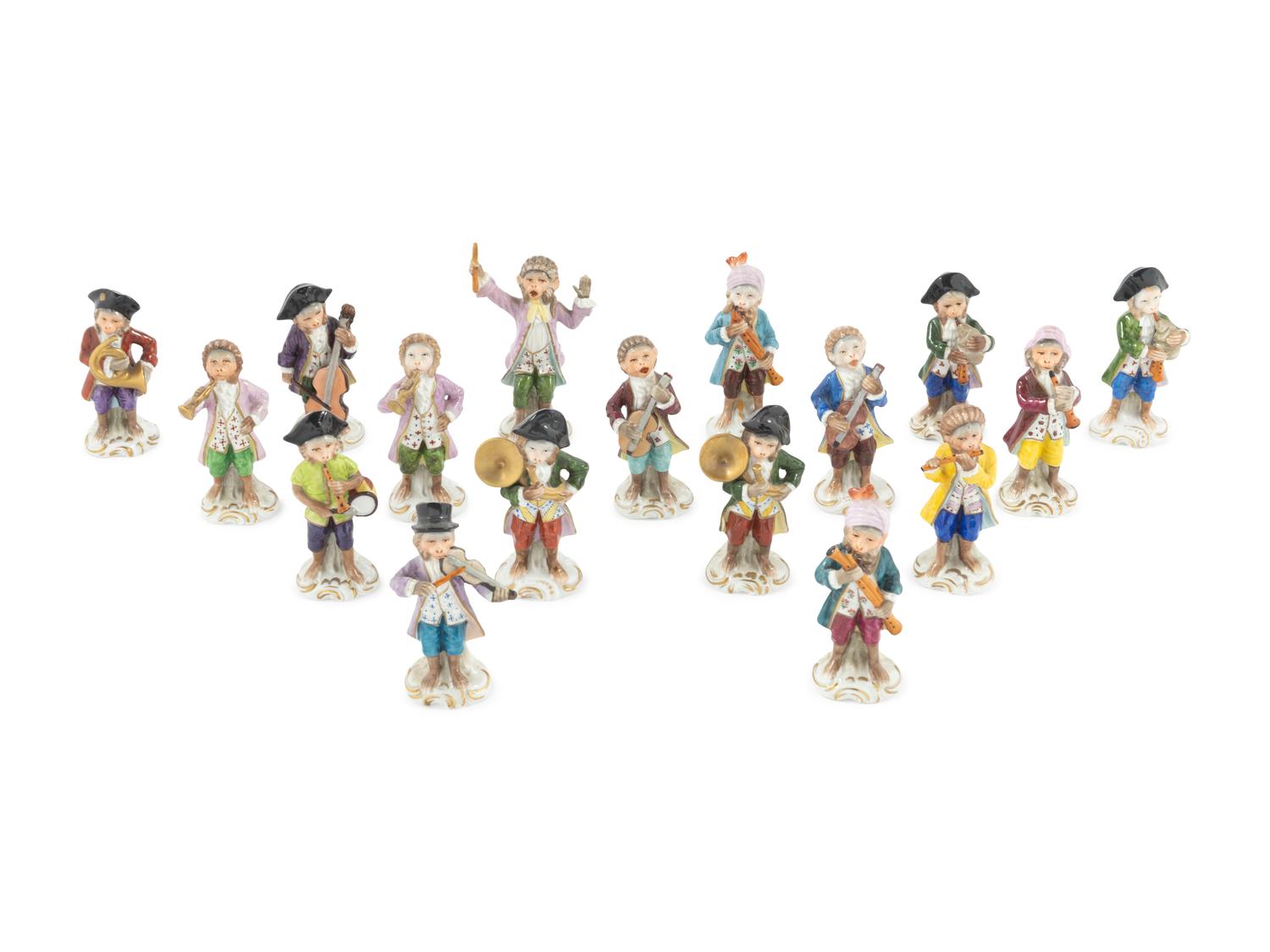 An Assembled Group of Seventeen Sitzendorf Porcelain Monkey Band Figures