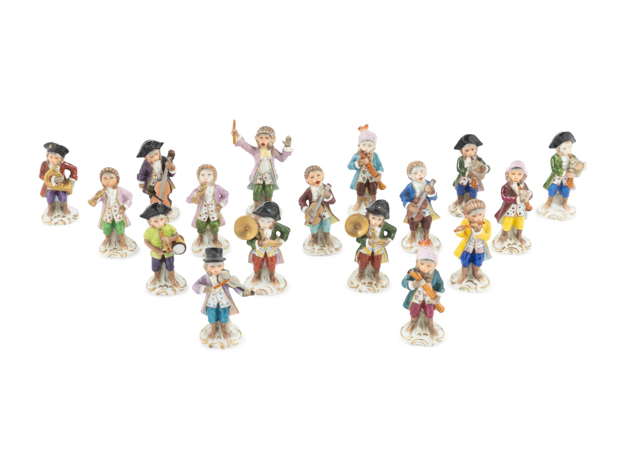 An Assembled Group of Seventeen Sitzendorf Porcelain Monkey Band Figures