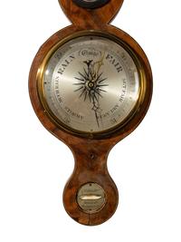 An English Mahogany Wheel Barometer and Thermometer