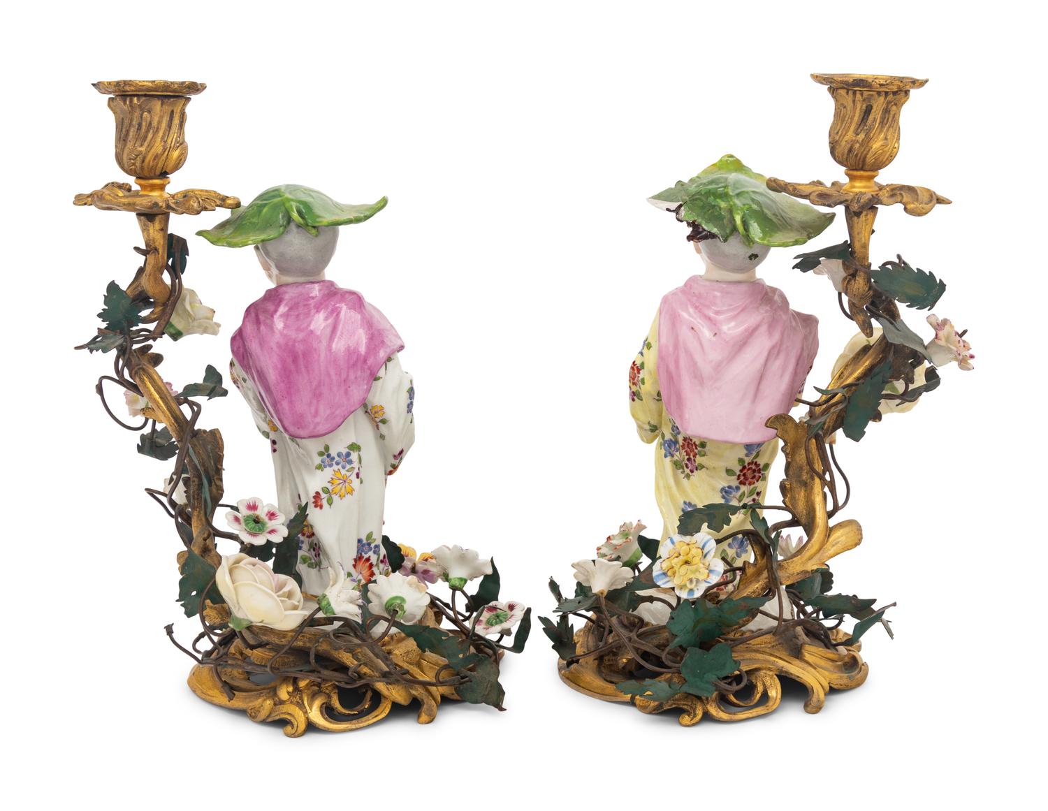 A Pair of French Porcelain, Tôle, and Gilt Bronze Figural Candlesticks