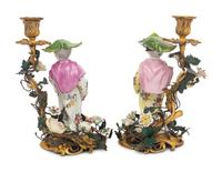 A Pair of French Porcelain, Tôle, and Gilt Bronze Figural Candlesticks