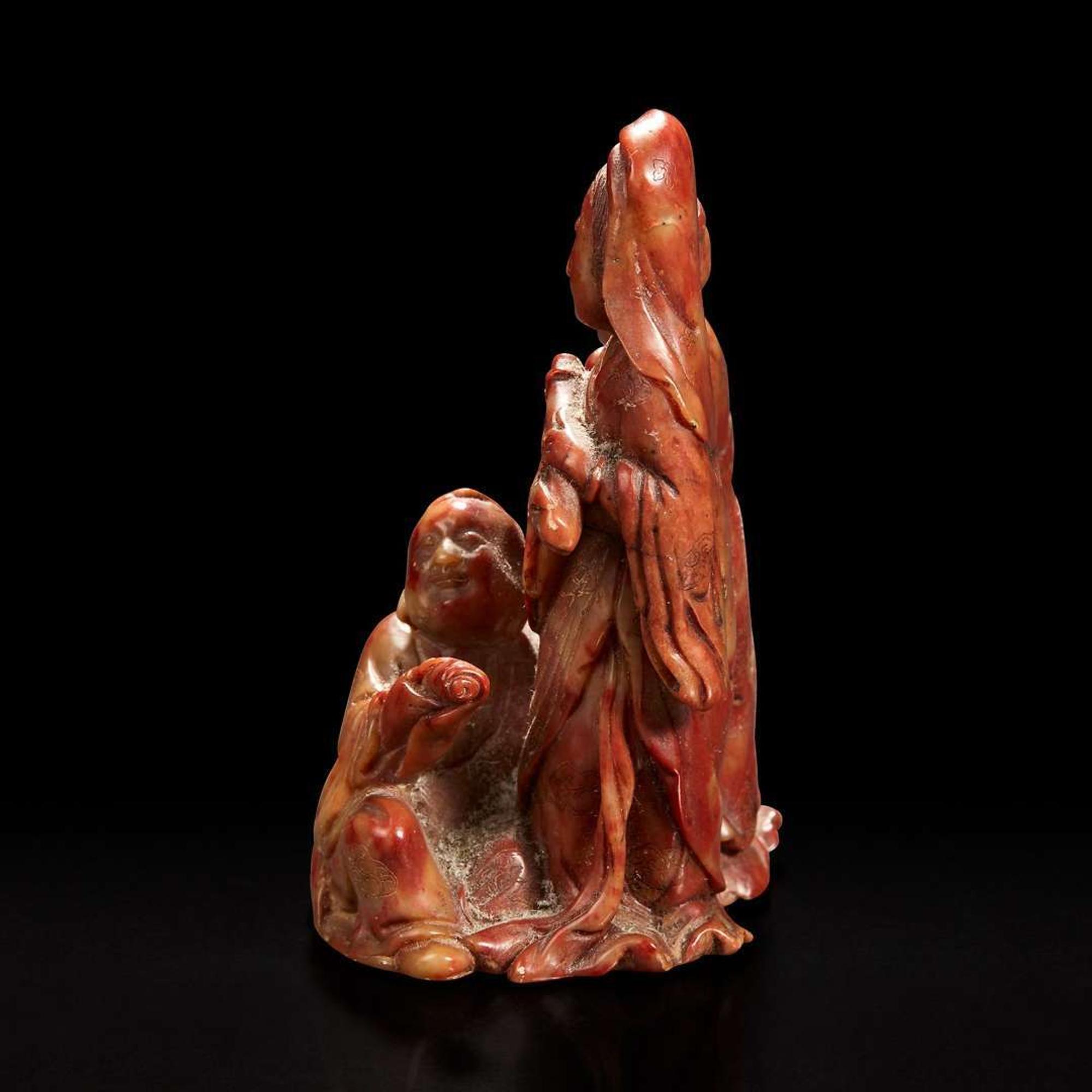 A Chinese carved soapstone figural group