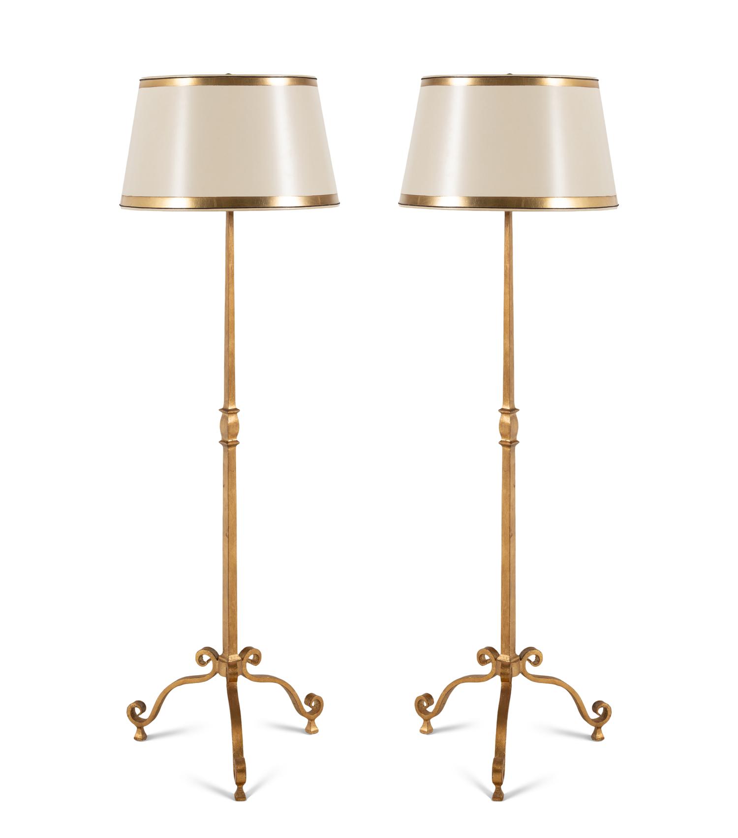 A Pair of Ebanista Gilt Metal Floor Lamps