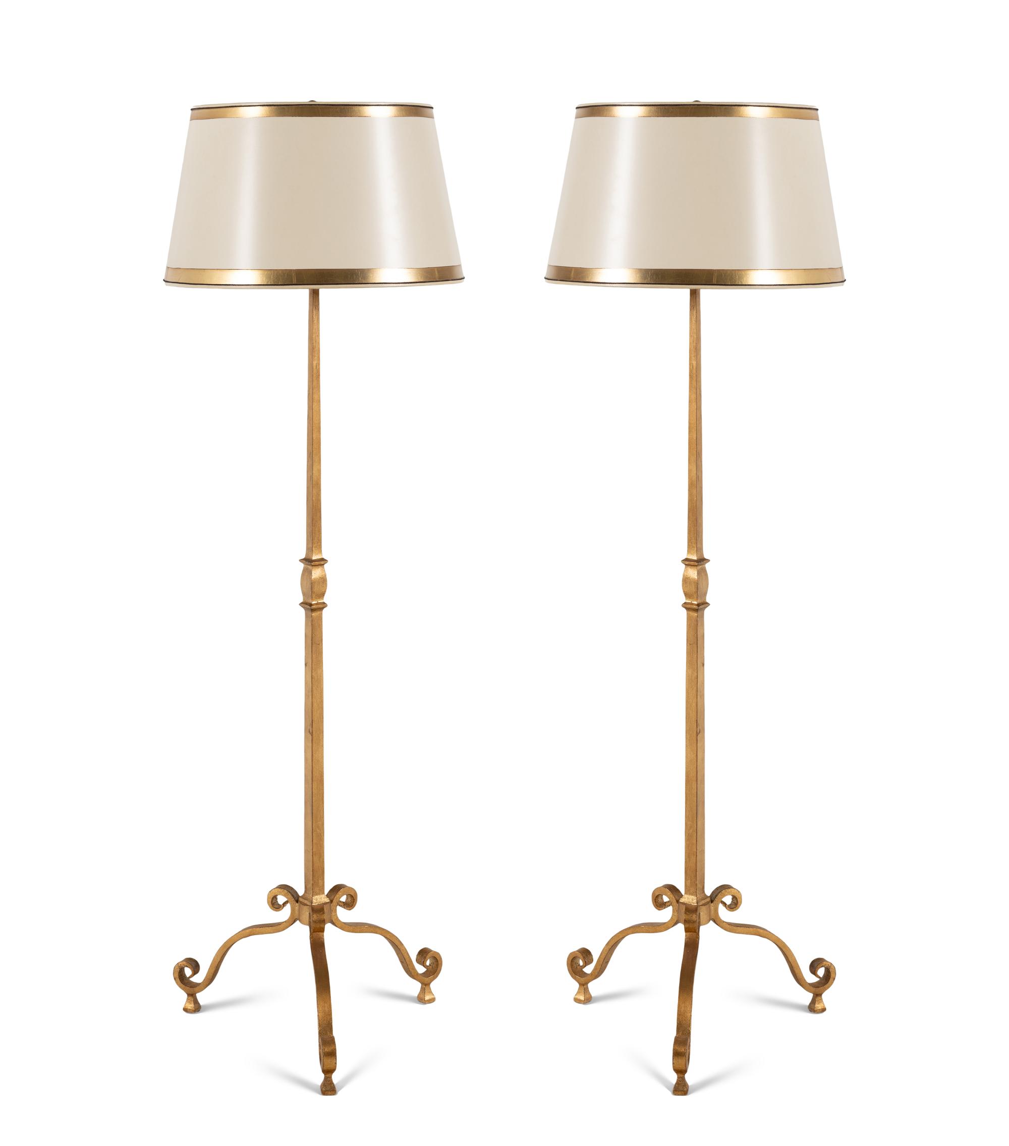 A Pair of Ebanista Gilt Metal Floor Lamps