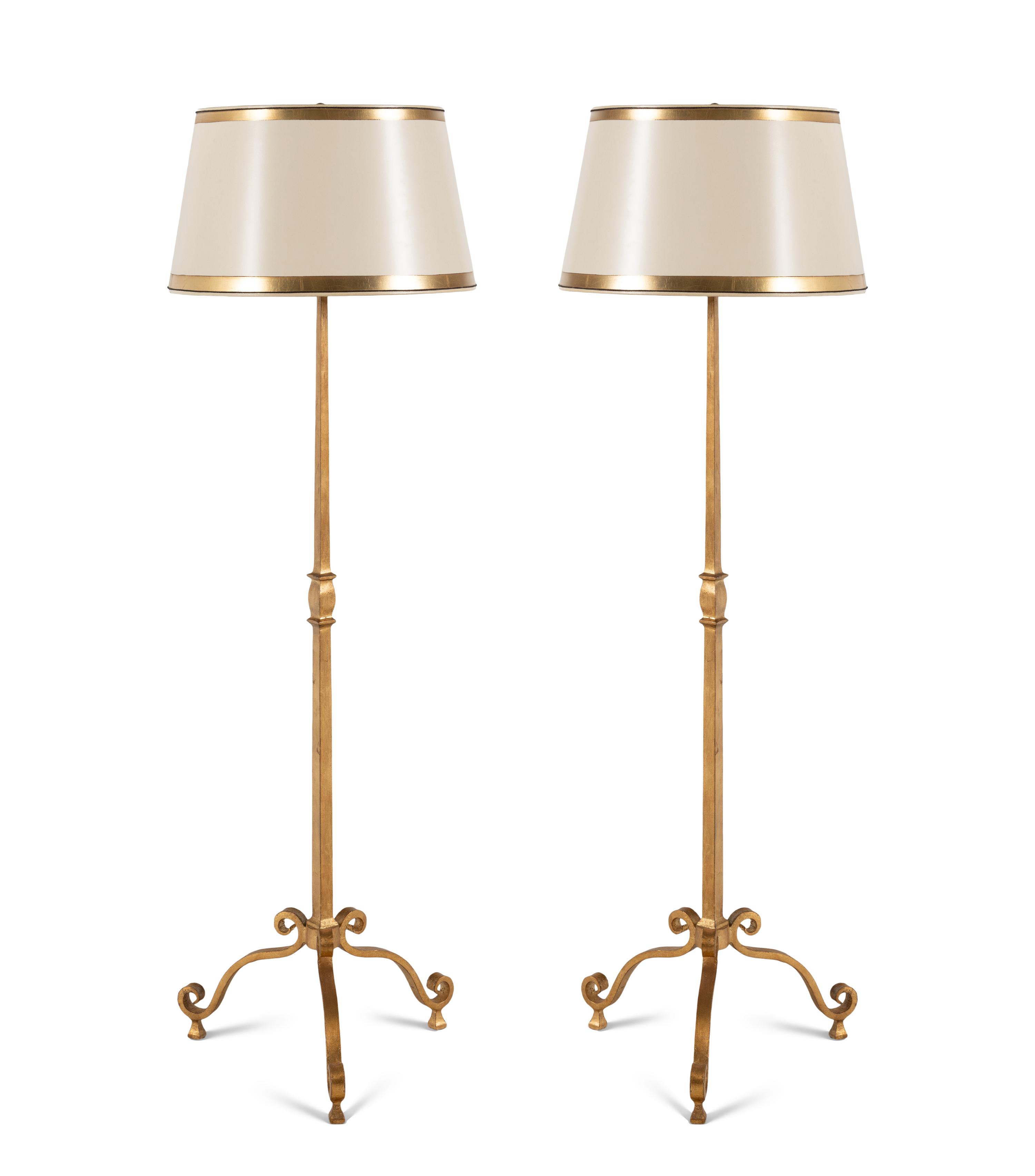 A Pair of Ebanista Gilt Metal Floor Lamps
