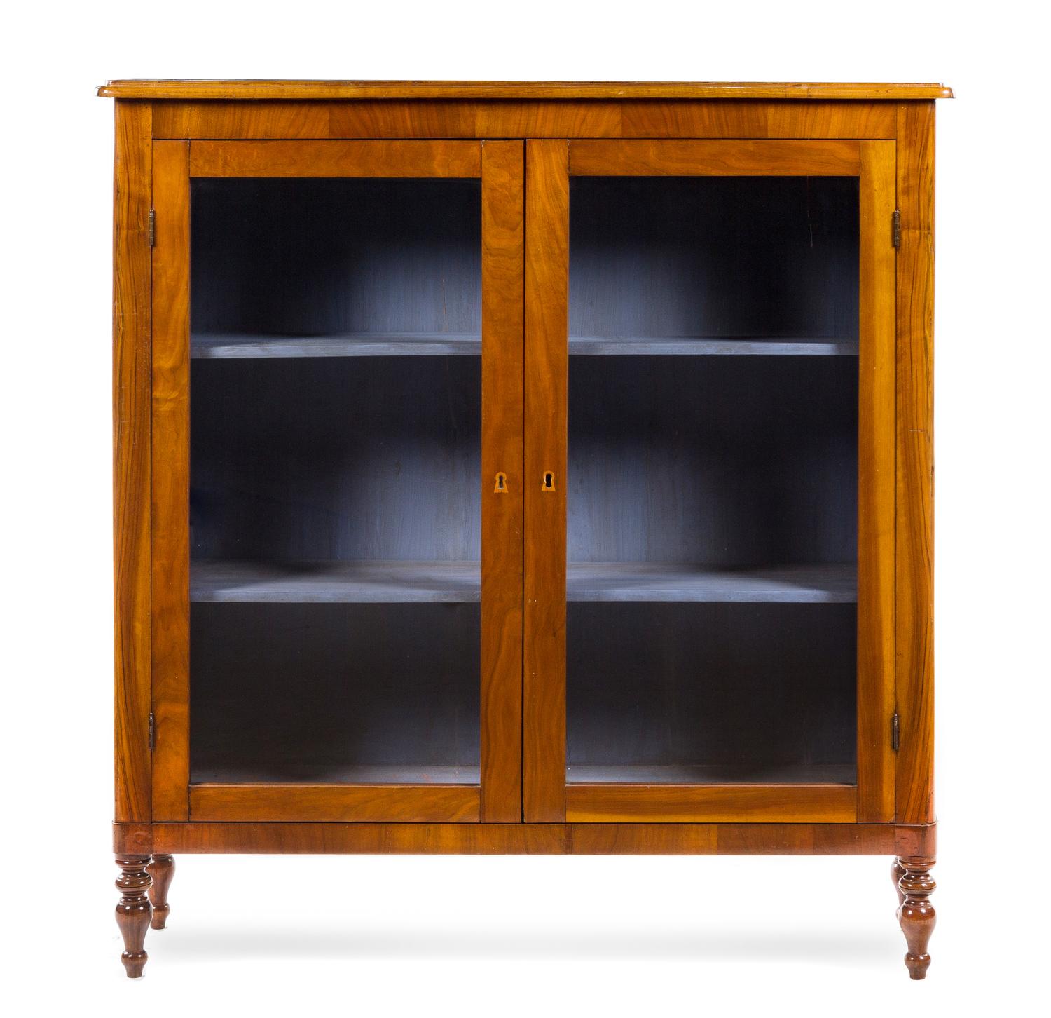 An Italian Walnut Bookcase Height 51 3/8 x width 48 1/2 x depth 13 inches. — 19TH CENTURY