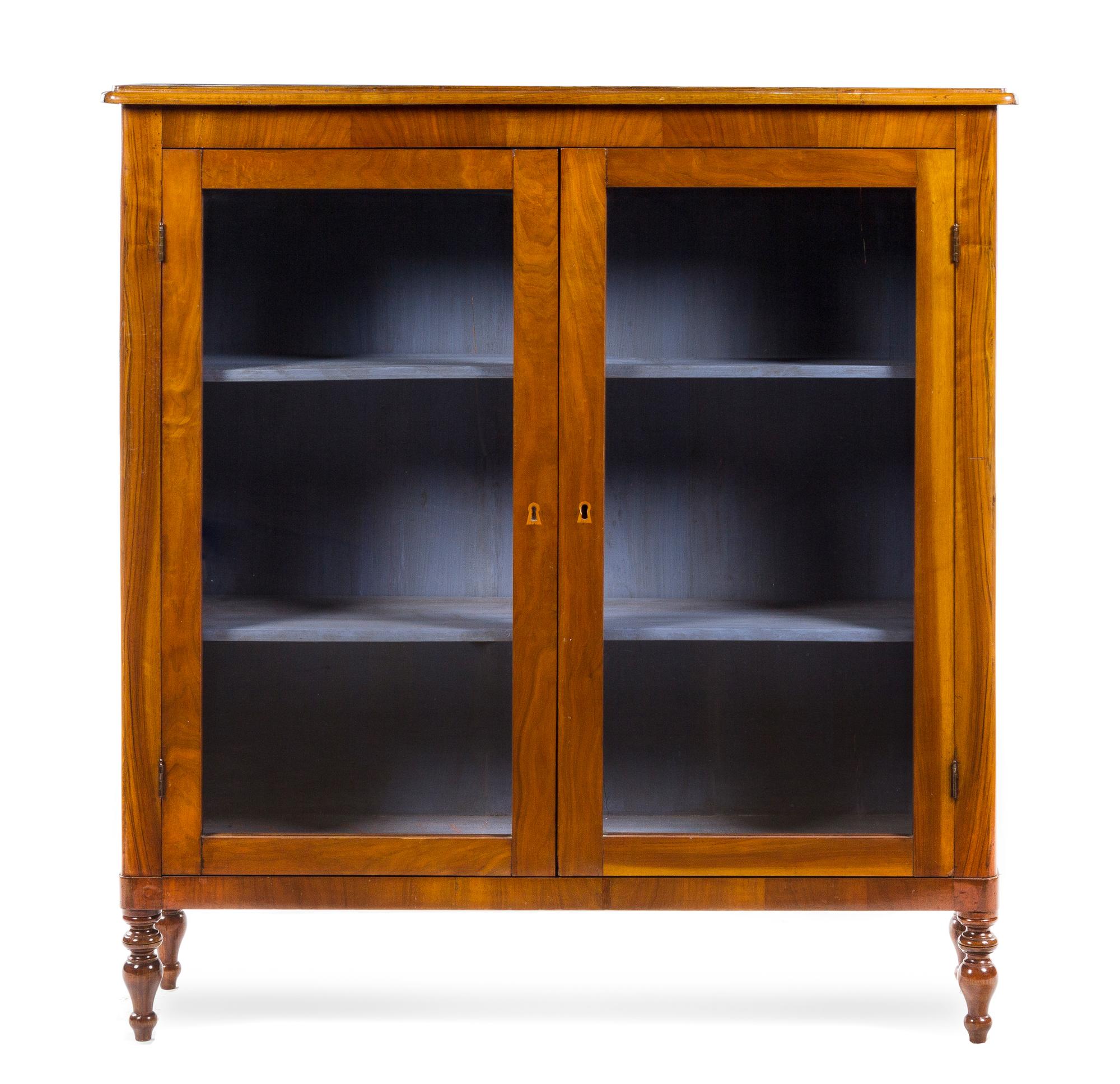 An Italian Walnut Bookcase Height 51 3/8 x width 48 1/2 x depth 13 inches. — 19TH CENTURY