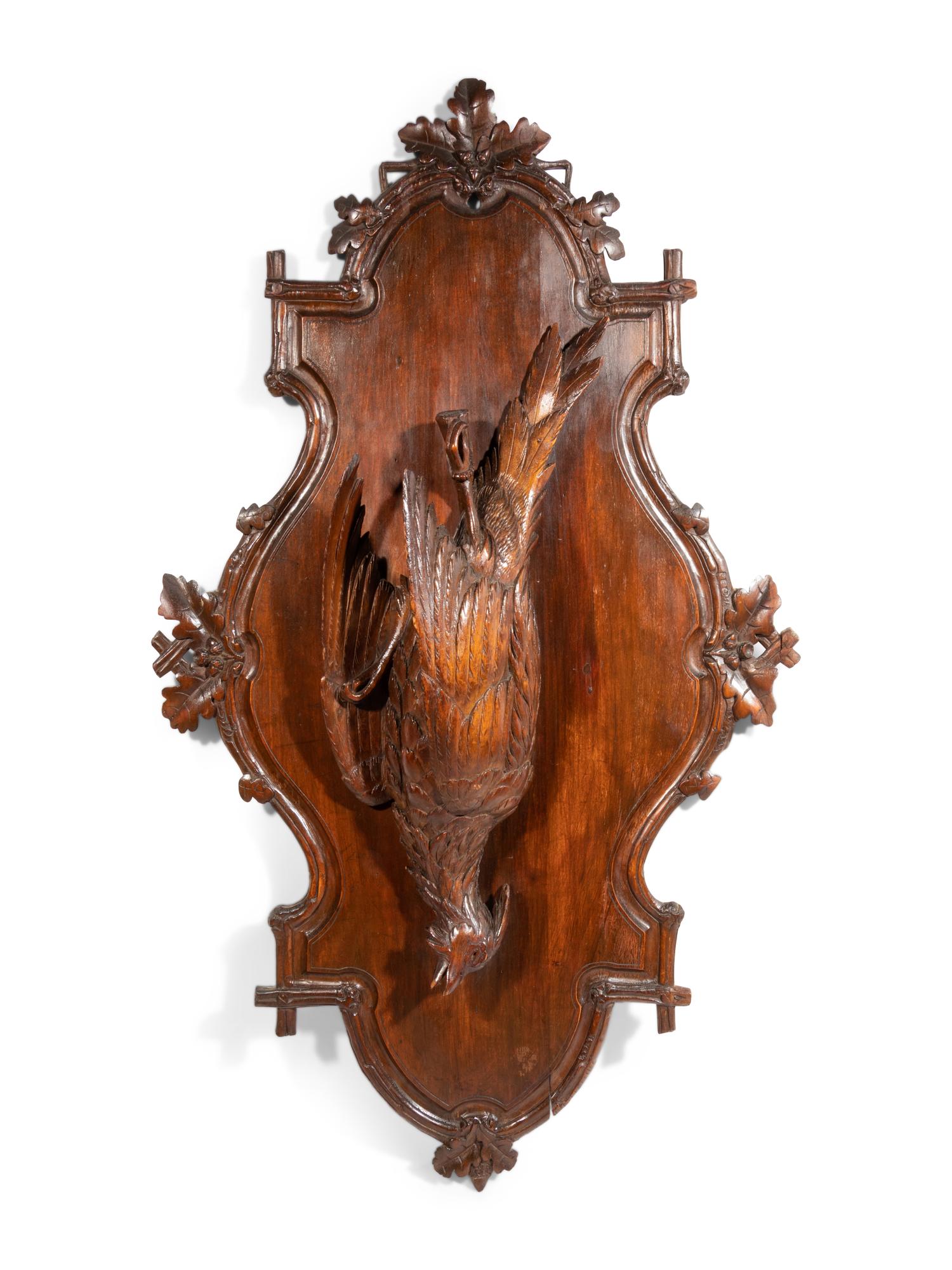 A Black Forest Carved Game Bird Wall Plaque