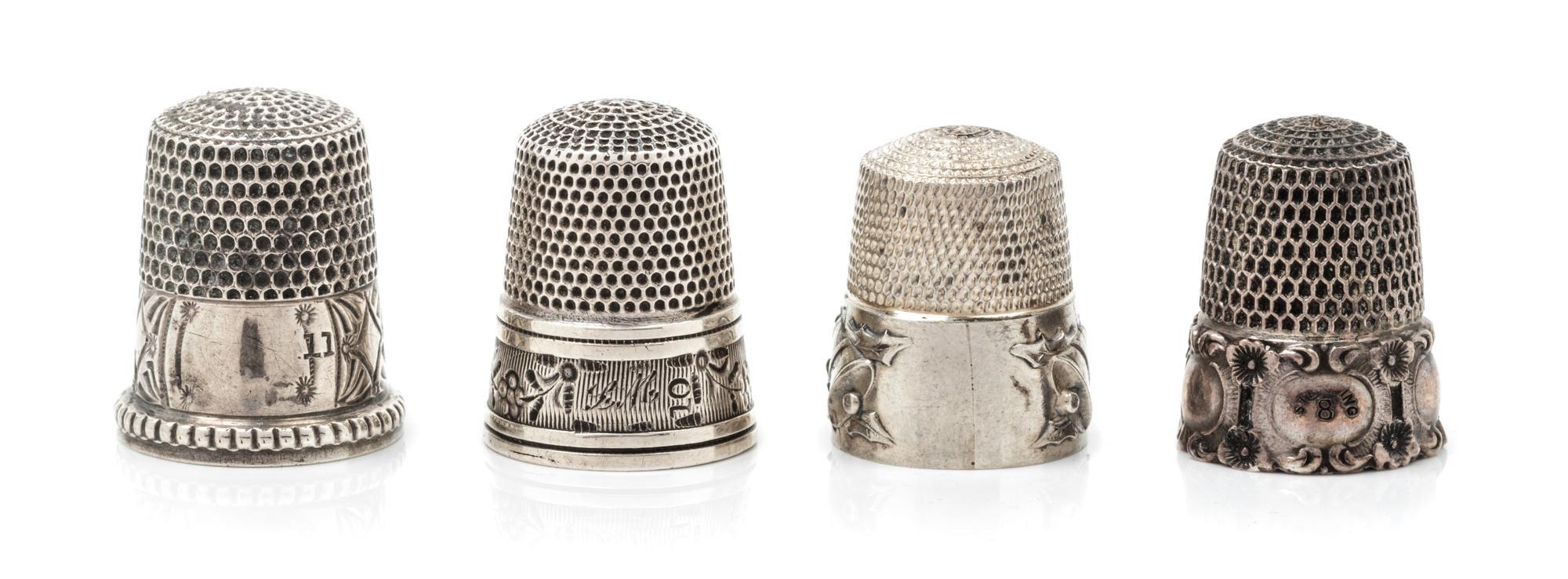 Four American Silver Thimbles, Simons Bros., Philadelphia, PA, compsiring a Holly & Bells restrike example; an example having a floral