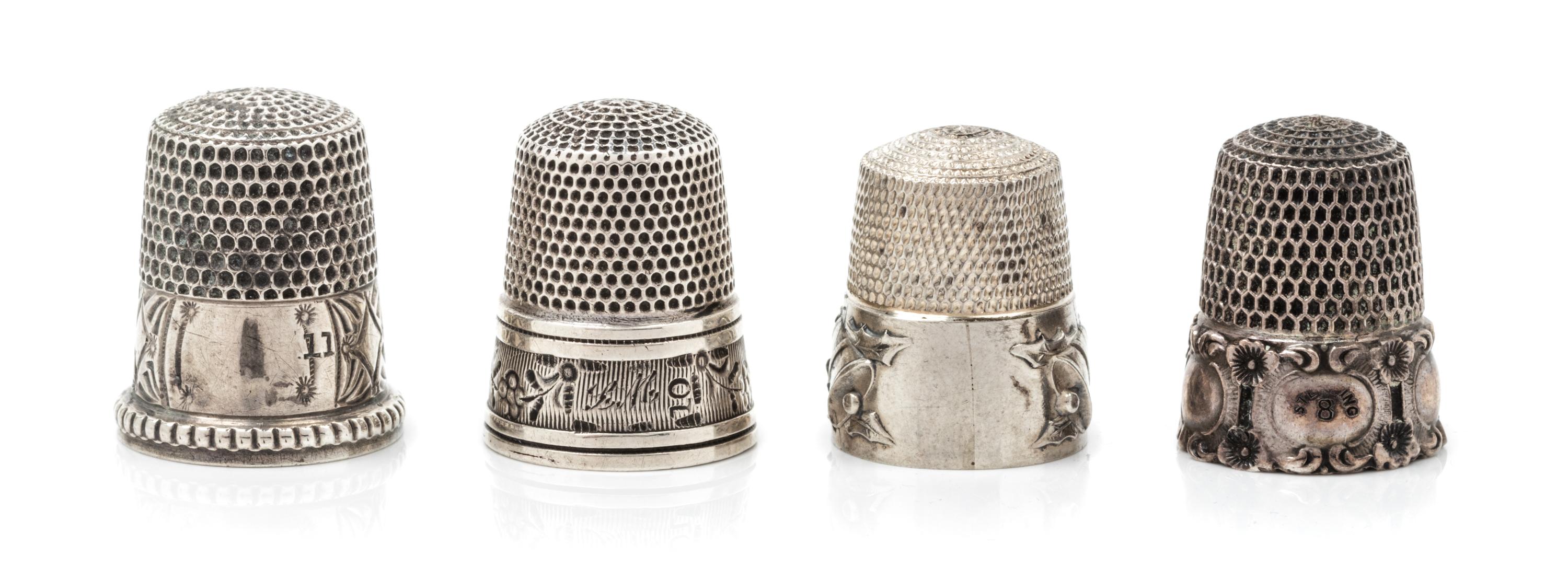 Four American Silver Thimbles, Simons Bros., Philadelphia, PA, compsiring a Holly & Bells restrike example; an example having a floral