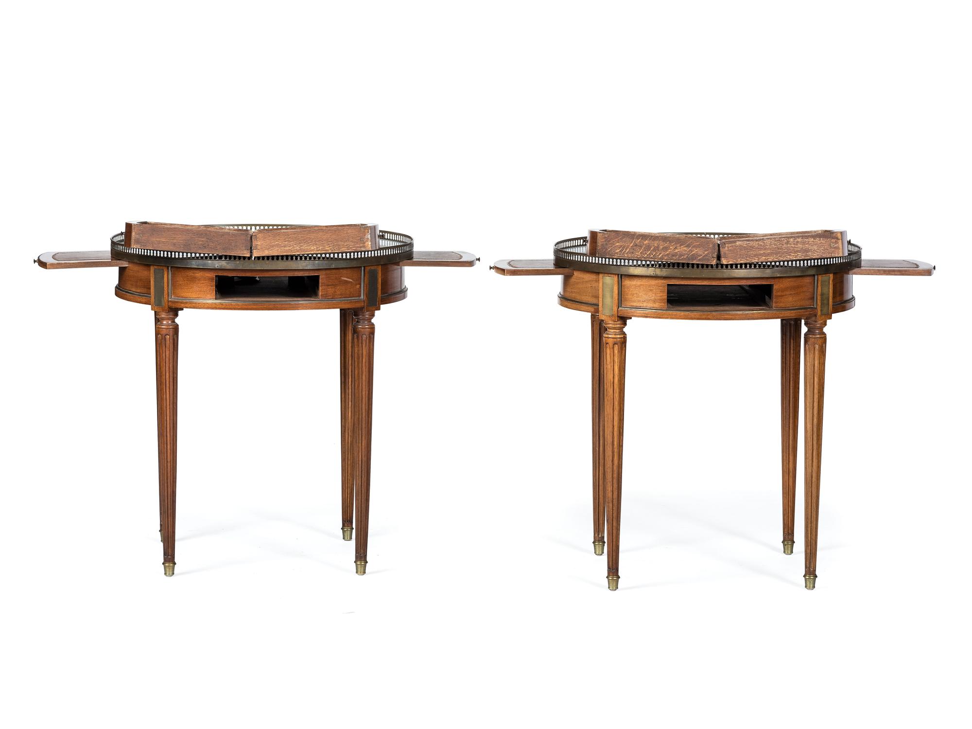 A Pair of Jacques Bodart Louis XVI Style Marble Top Bouillotte Tables