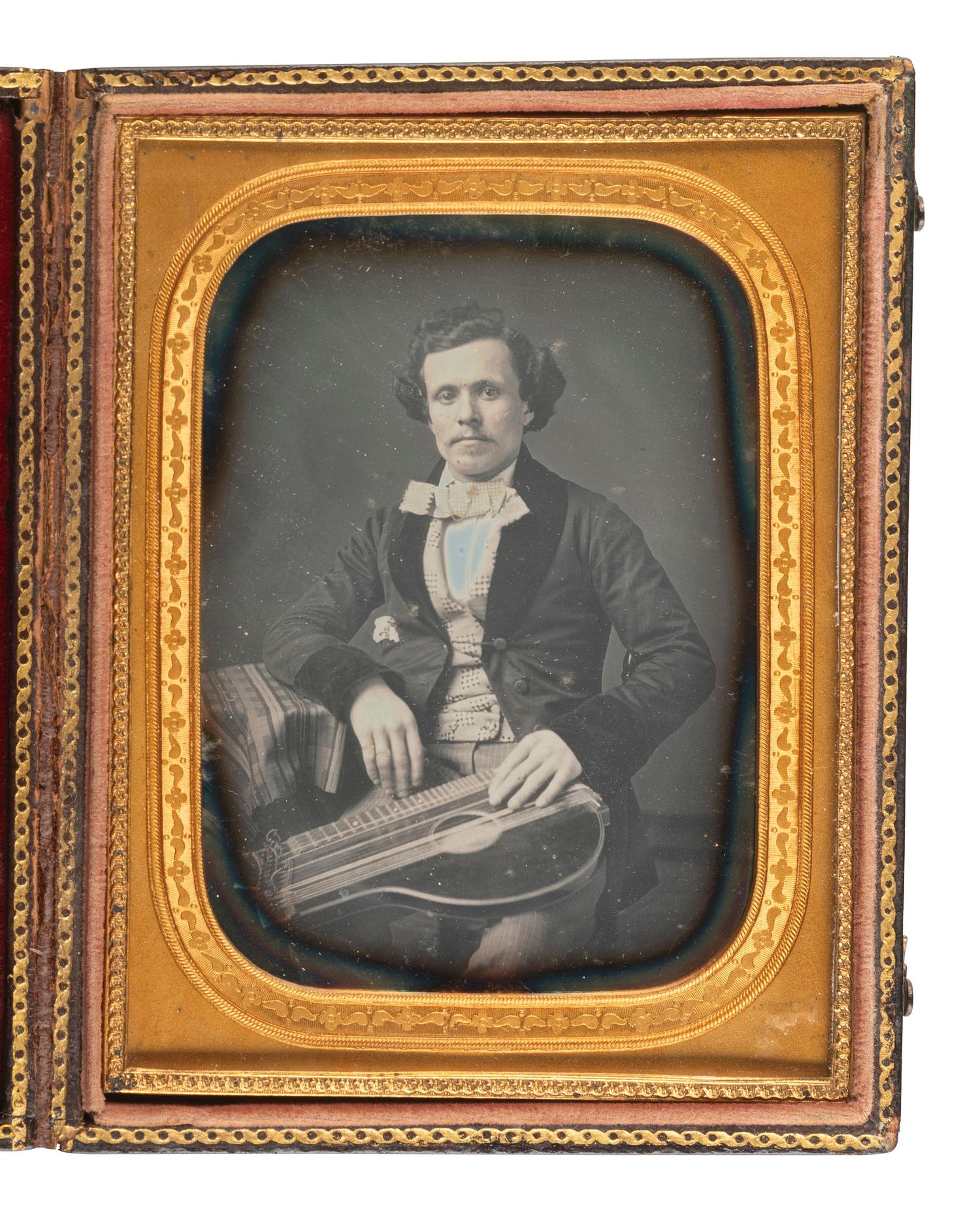 [EARLY PHOTOGRAPHY]. Quarter plate daguerreotype of a musician posed with his zither by LYTLE.