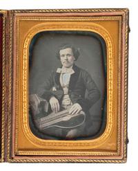 [EARLY PHOTOGRAPHY]. Quarter plate daguerreotype of a musician posed with his zither by LYTLE.