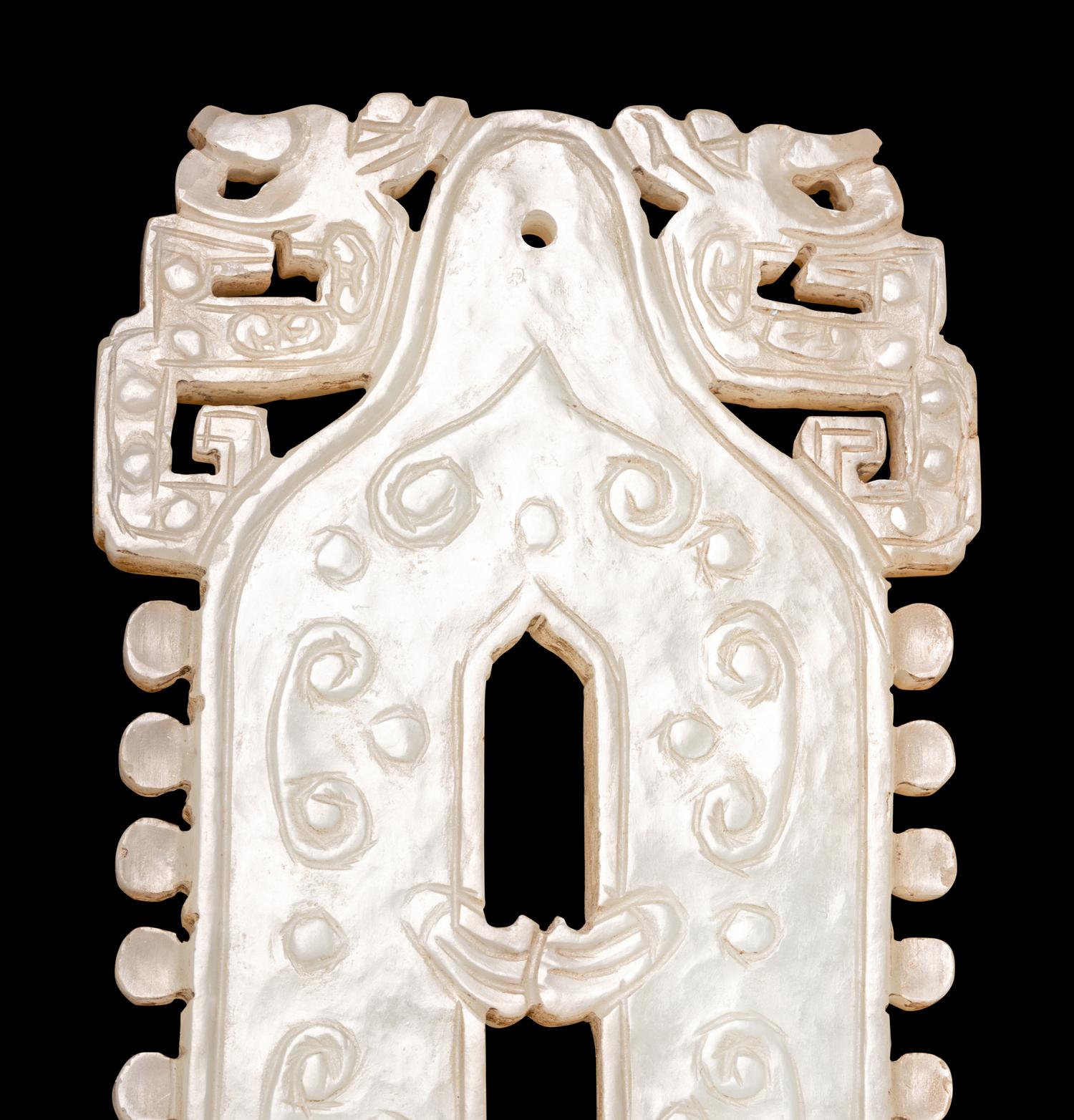 A Celadon Jade Bell-Form Pendant