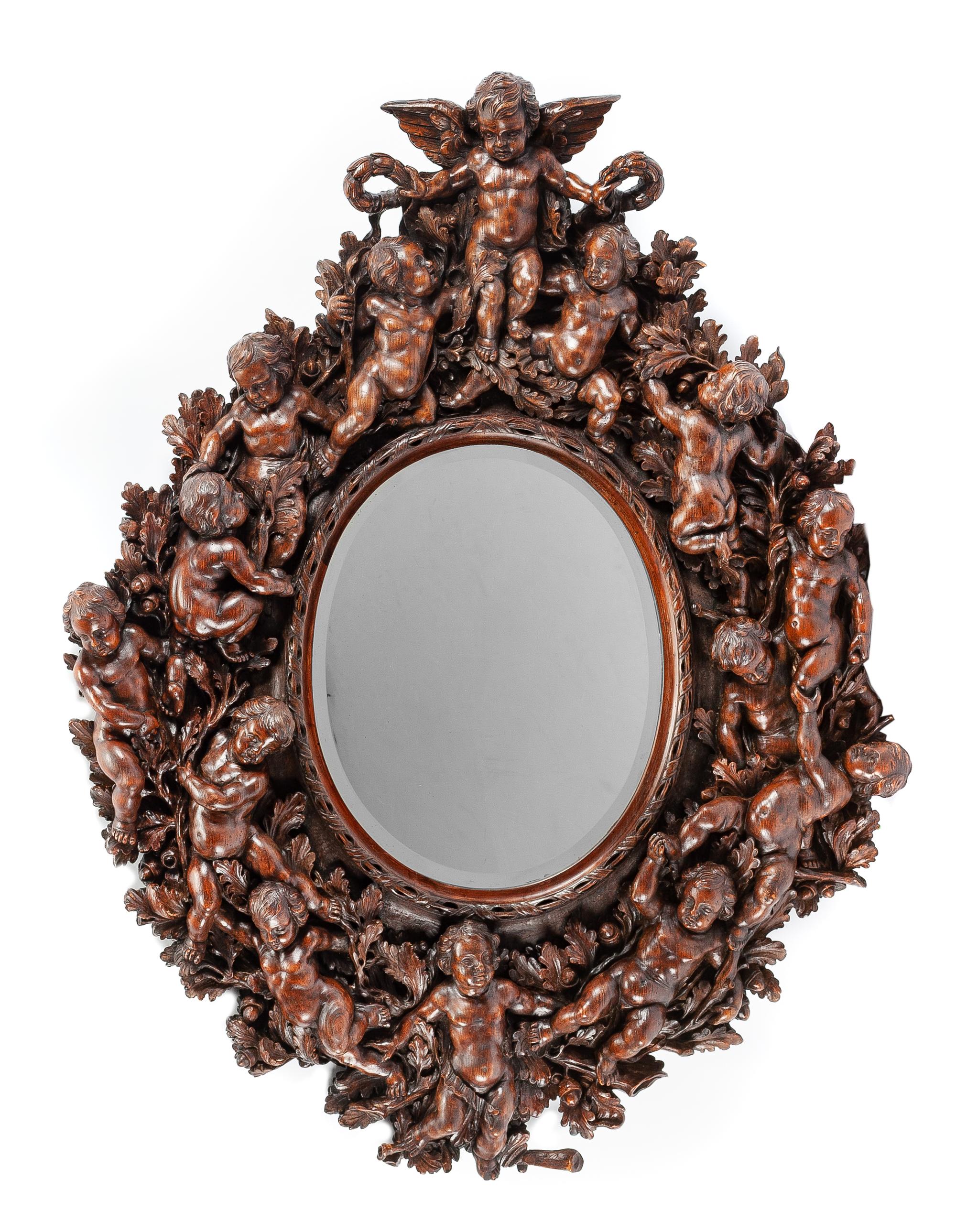 An Italian Renaissance Revival Carved Walnut Mirror Height 61 x width 45 inches. — SIGNED G.F. LIETTY, 19TH CENTURY