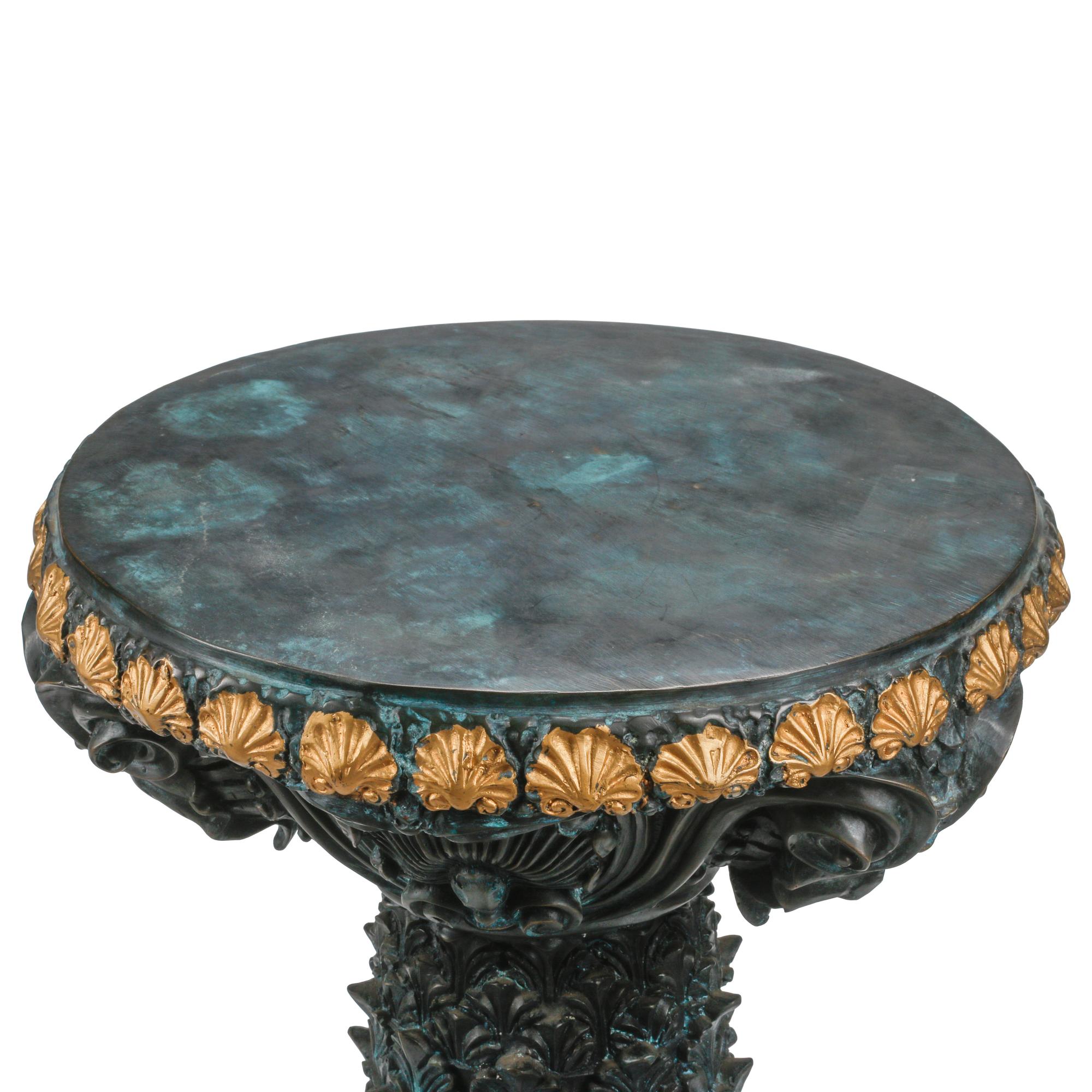 A Pair of Régence Style Patinated and Parcel Gilt Bronze Pedestals
