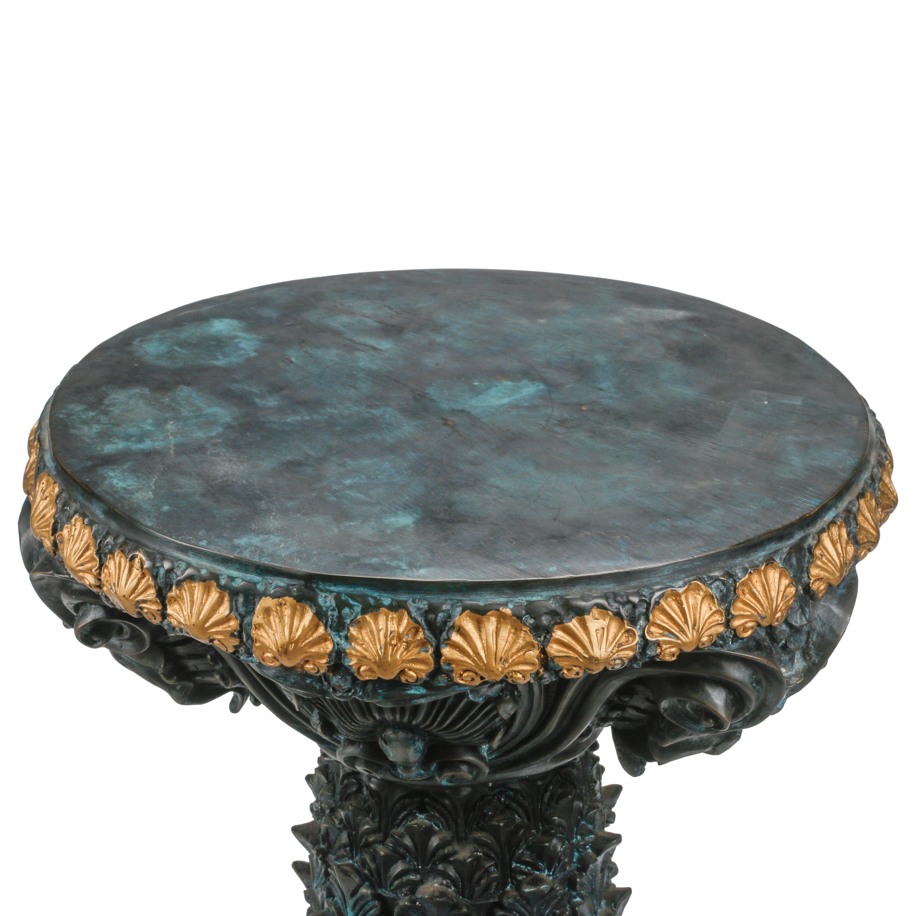 A Pair of Régence Style Patinated and Parcel Gilt Bronze Pedestals