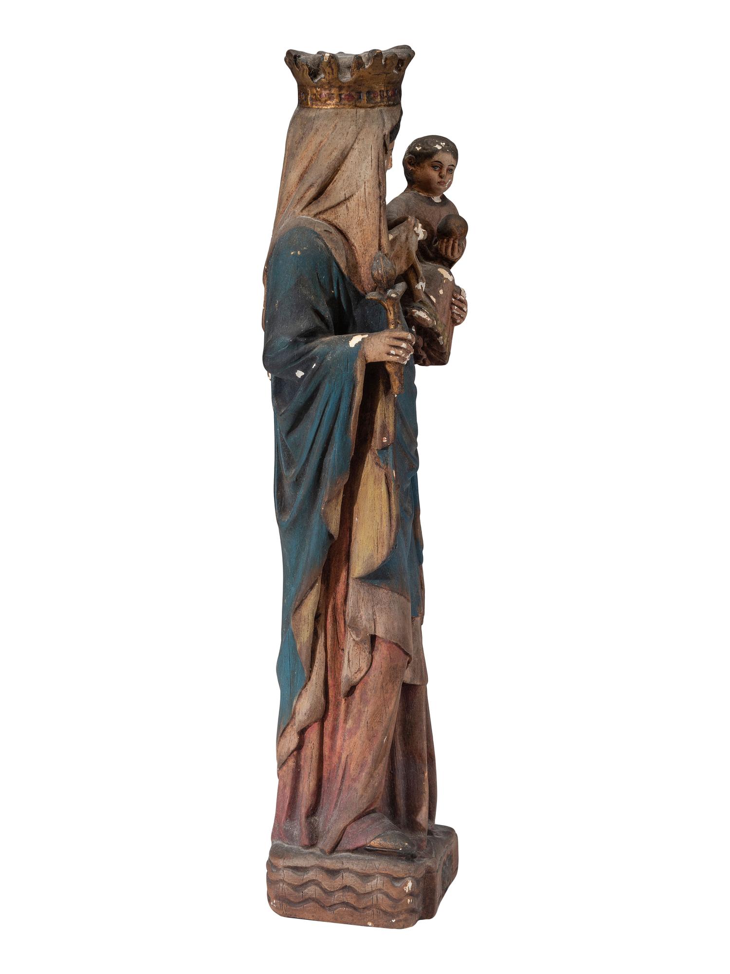 A Continental Paint Decorated Chalkware Santos Figure of the Madonna and Child
